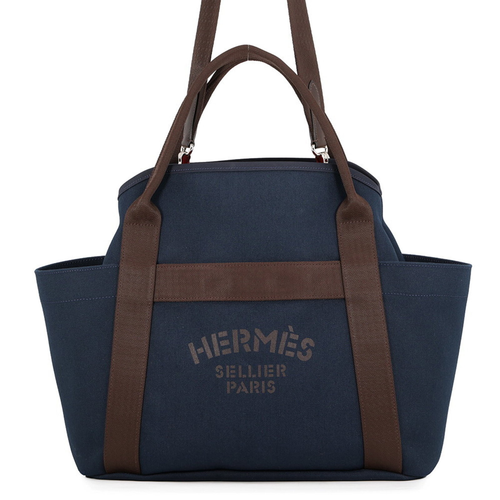 Canvas Handbag Chevron Hermes: Canvas Handbag Chevron Hermes Canvas Handbag Chevron Hermes features a striking Feu and Navy color combination on a high-quality canvas material, with a classic chevron design that adds a touch of