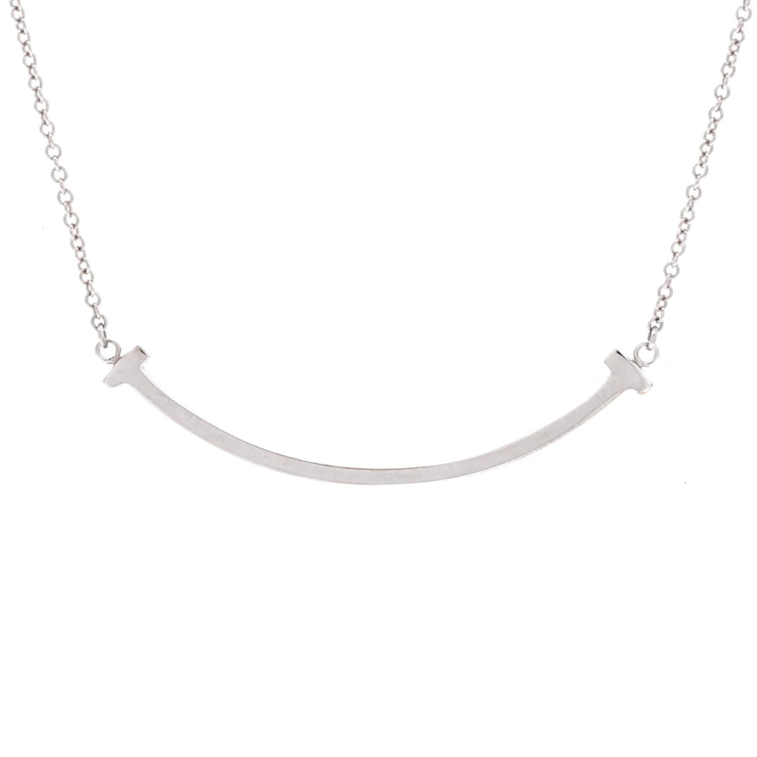 Tiffany White Gold Small 18K Pendant Necklace T Smile: Tiffany White Gold Small 18K Pendant Necklace T Smile Tiffany & Co.'s T Smile Pendant Necklace is a stunning 18K white gold piece, featuring a small pendant with a length of 16.0 - 18.0 inches and a 9