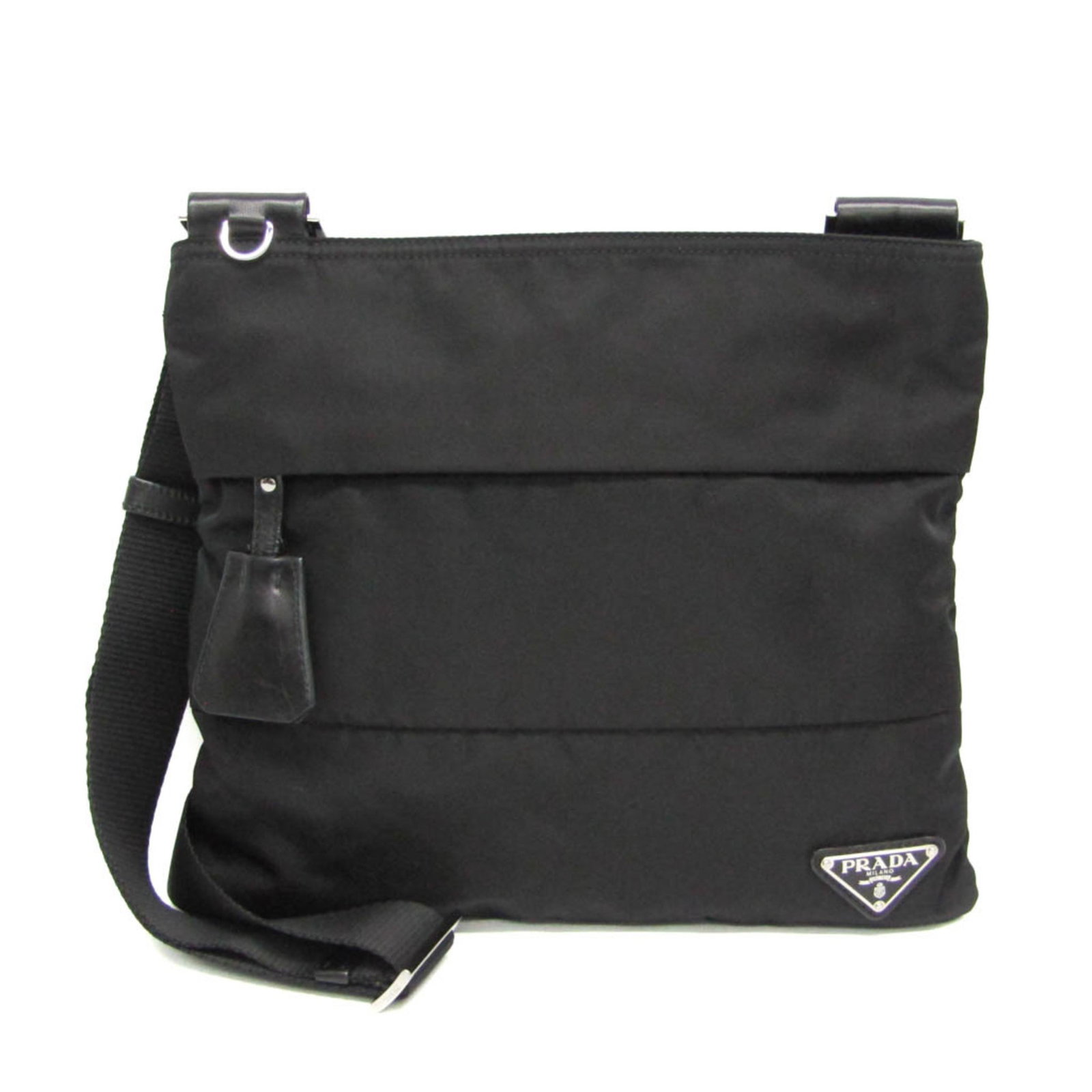 Shoulder Bag Nylon: Shoulder Bag Nylon Black Prada TESSUTO shoulder bag made from durable nylon, featuring a sleek design with a zipper closure and two functional pockets for added convenience. The bag's adjustable