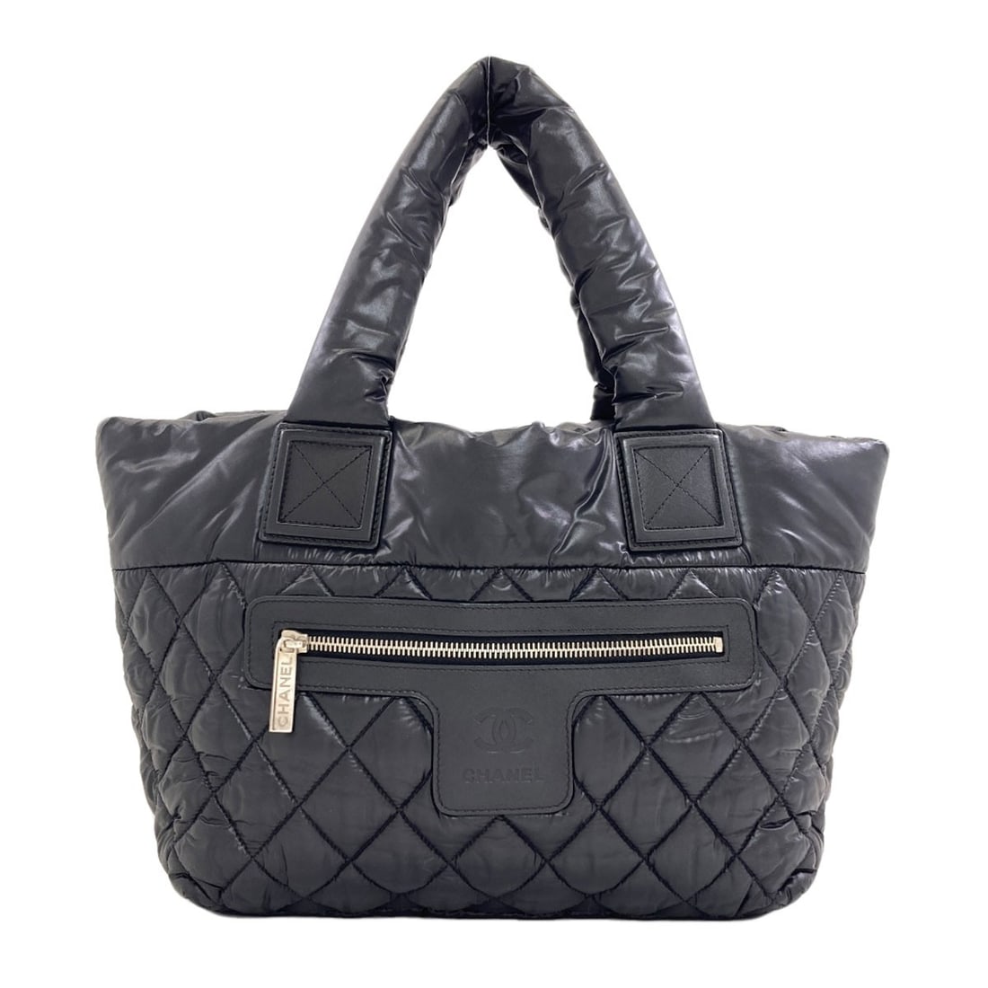 Chanel Cocoko Koon Silverhardware Handbag Nylon: Chanel Cocoko Koon Silverhardware Handbag Nylon This CHANEL Cocoko Koon handbag features silver hardware and is made from high-quality nylon. Its sleek black design and durable construction make it a