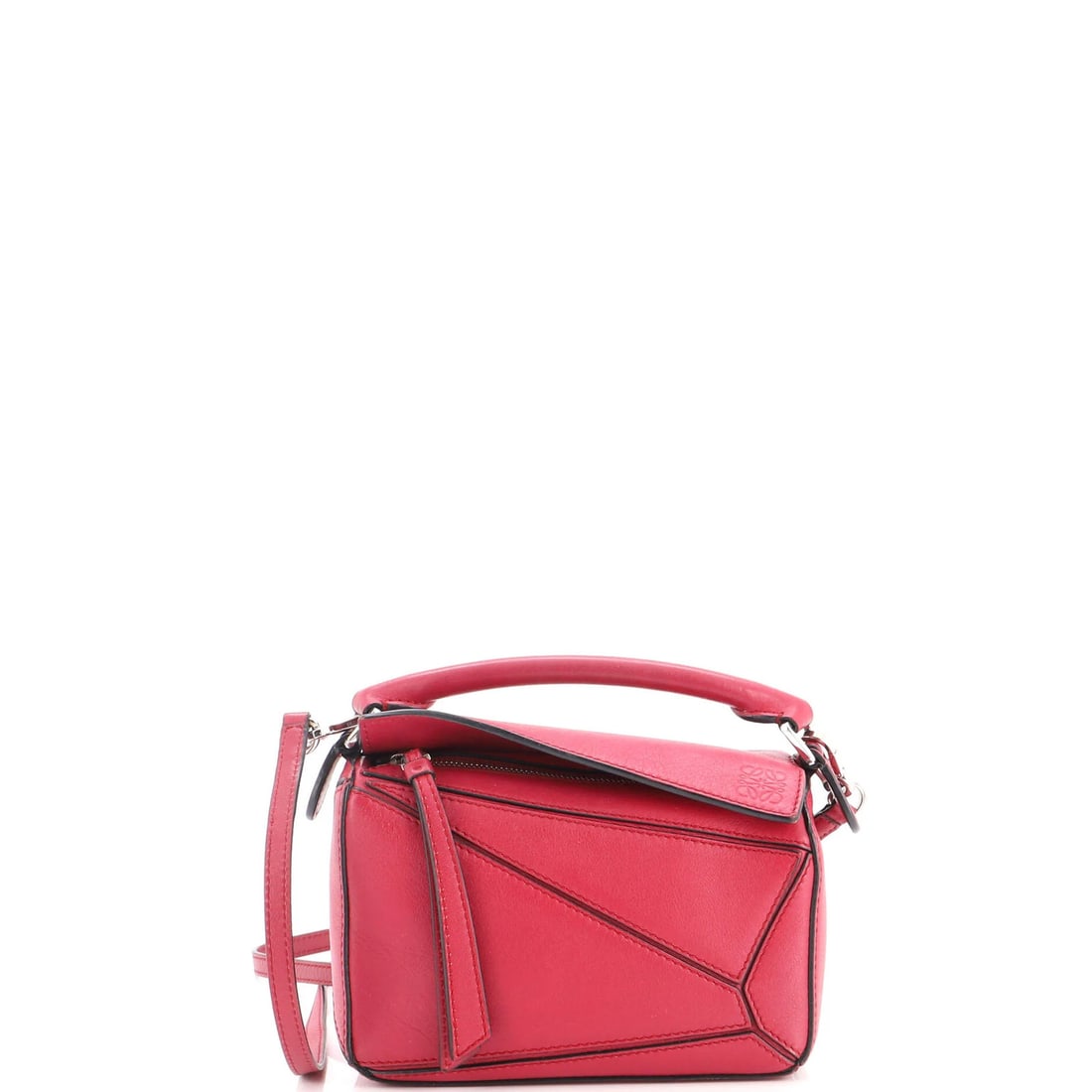 Loewe Puzzle Bag Leather Mini: Loewe Puzzle Bag Leather Mini The Loewe Puzzle Bag Leather Mini is a stylish and compact cross body bag, featuring a bold red exterior and neutral interior. With its 15.5-23.5" adjustable strap, this