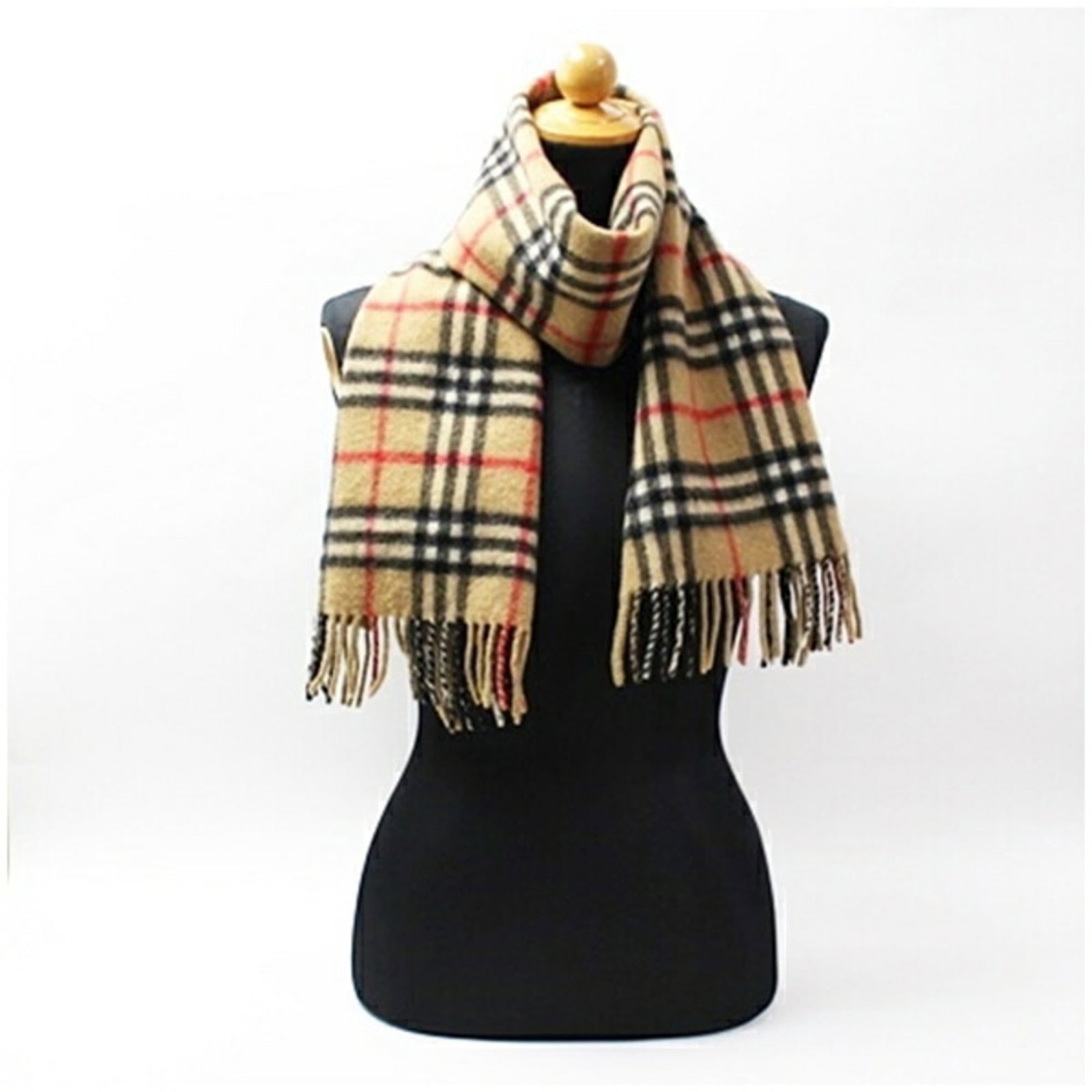 Burberry Stole Cashmere: Burberry Stole Cashmere Cashmere stole from Burberry, measuring 1.42m x 31cm, crafted from the luxurious material. This stole boasts a classic camel color, adding a touch of sophistication to any outf