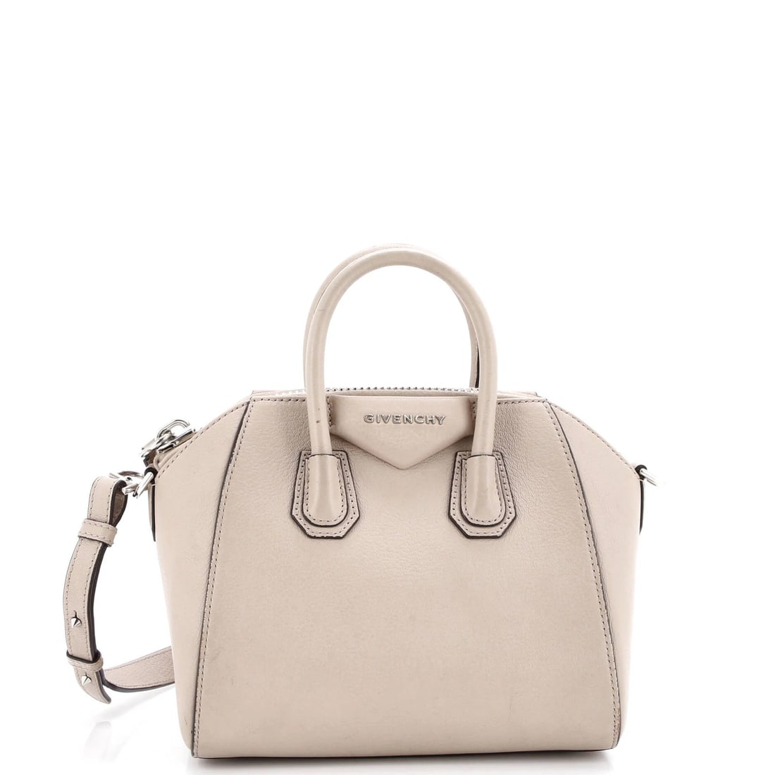 Leather Mini Bag Antigona Givenchy: Leather Mini Bag Antigona Givenchy The Givenchy Antigona Leather Mini Bag features a neutral exterior with a classic cross-body design, perfect for adding a touch of sophistication to any outfit. With