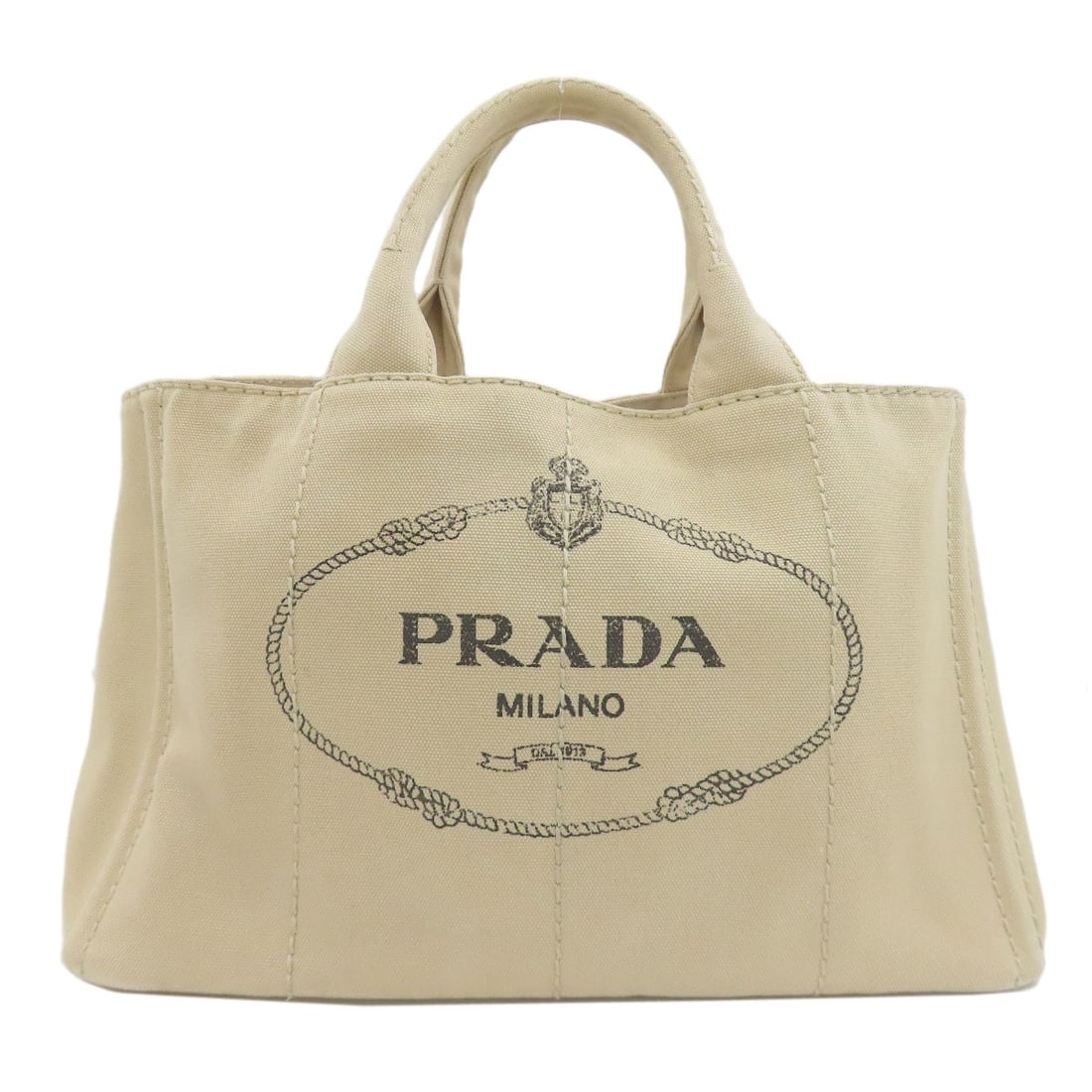 Canvas Prada Handbag Canapa: Canvas Prada Handbag Canapa Beige canvas Prada handbag with a classic design, bearing a signature. Made from canvas, this handbag features a timeless beige exterior color. The simple, understated styl