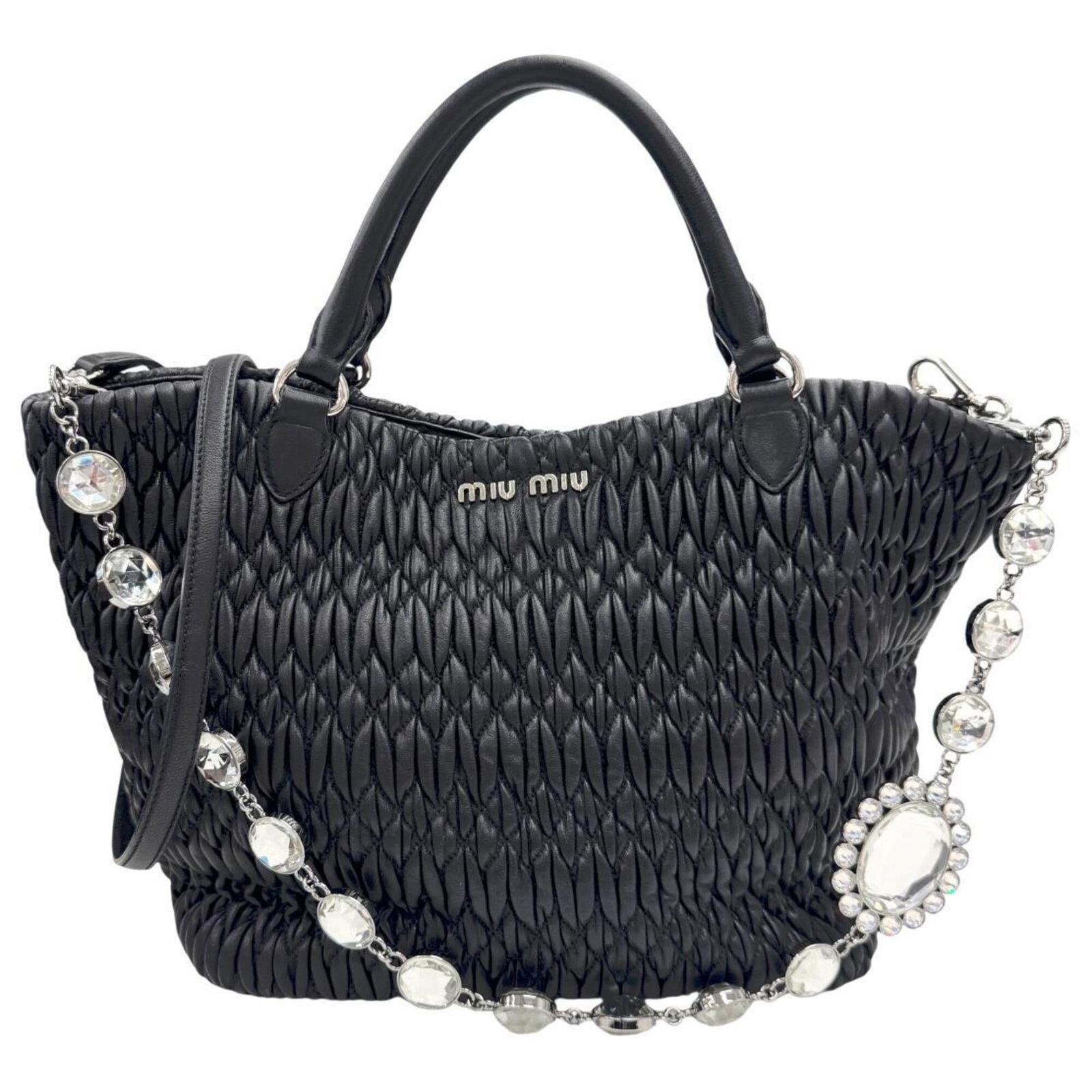 Miu Handbag Shoulder Bag Leather: Miu Handbag Shoulder Bag Leather The Miu Miu Handbag Shoulder Bag Leather is a sleek and sophisticated accessory, crafted from high-quality leather with a timeless black color. Measuring 21cm x 34cm