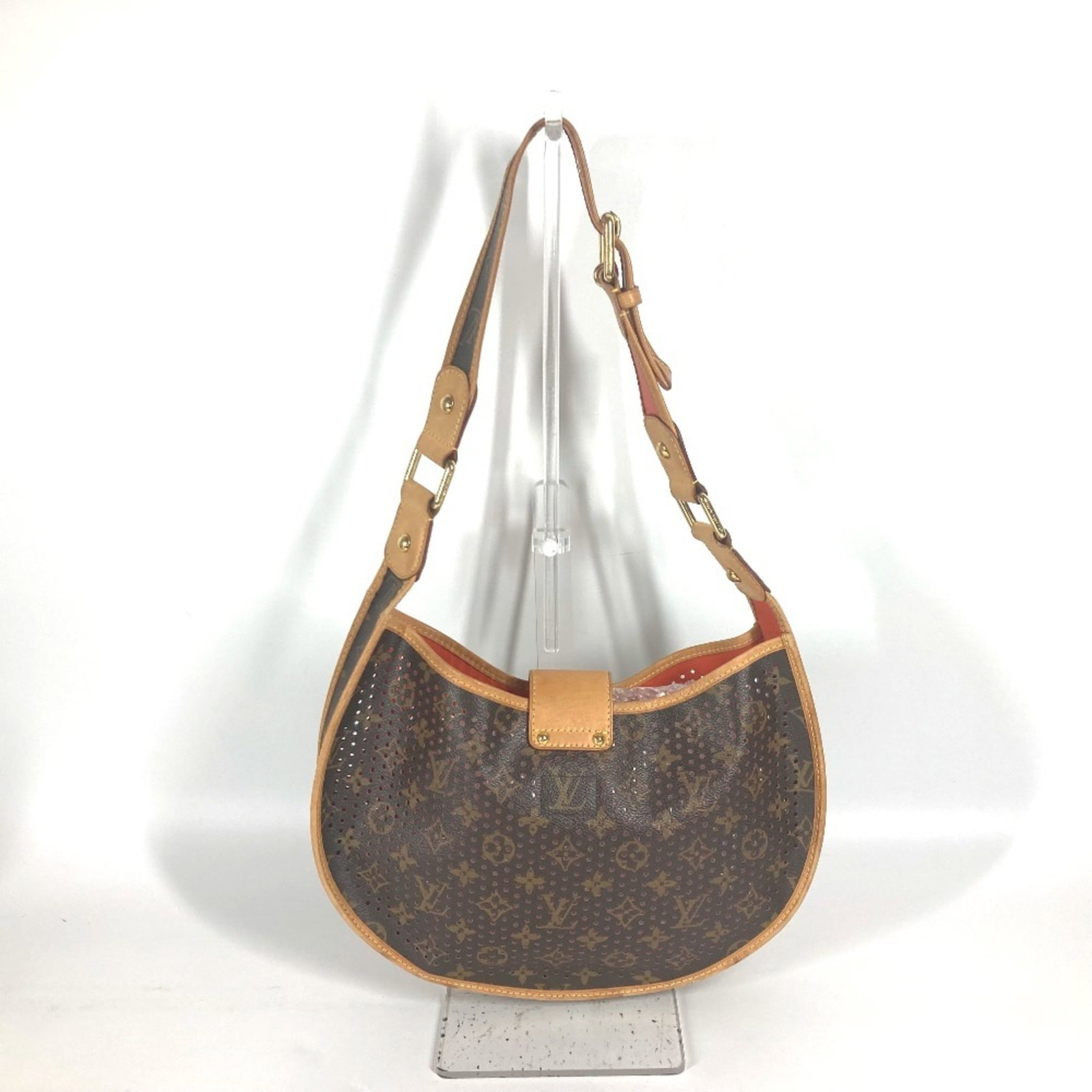 Shoulder Bag Monogram Louis Vuitton: Shoulder Bag Monogram Louis Vuitton Brown and Orange Monogram Louis Vuitton Shoulder Bag. This stylish bag features the iconic Louis Vuitton monogram pattern in a unique combination of brown and