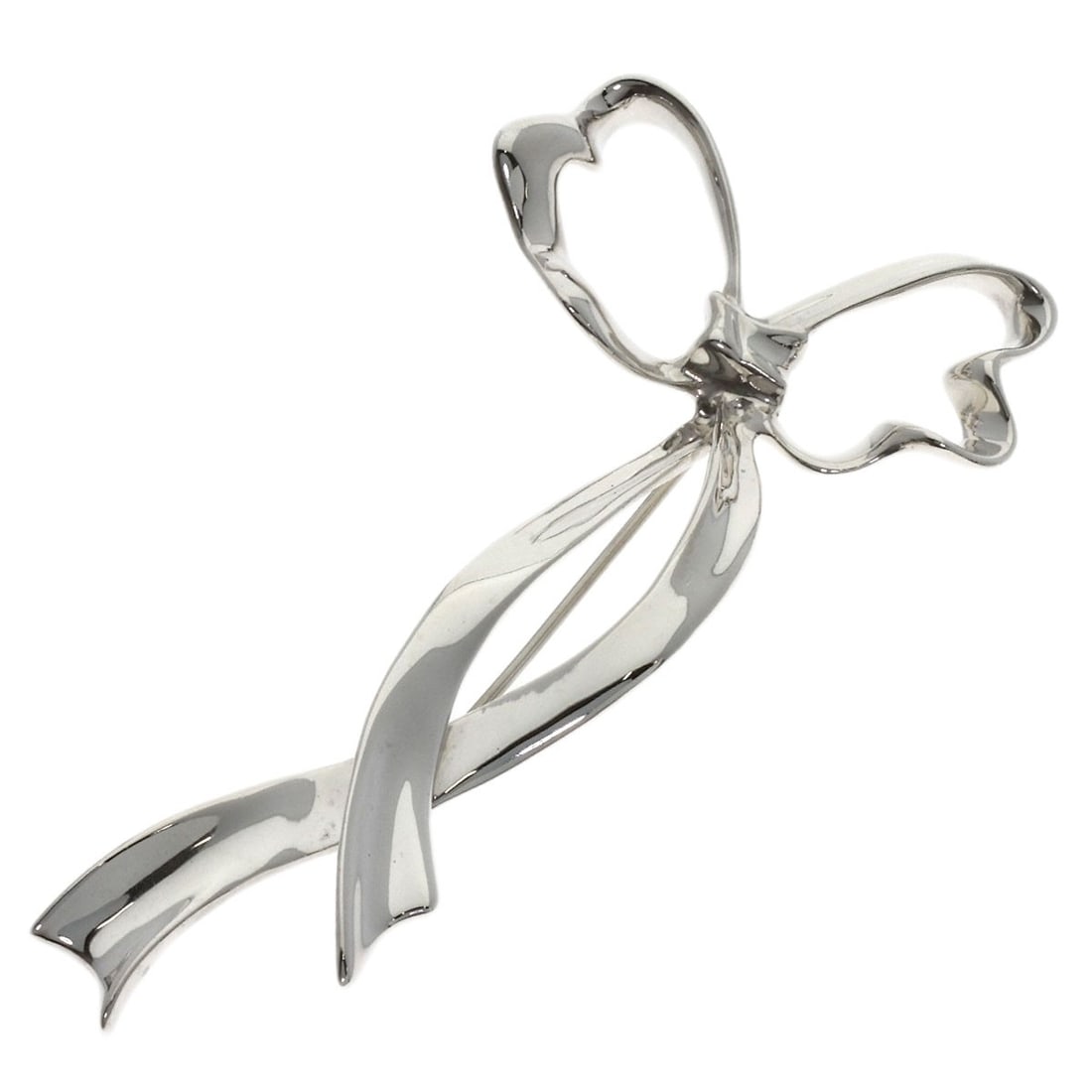 Tiffany Co Ribbon Motif Silver Brooch: Tiffany Co Ribbon Motif Silver Brooch Silver Ribbon Motif Brooch from Tiffany & Co. features a striking design with a silver ribbon motif, showcasing the luxury brand's signature style. Made from