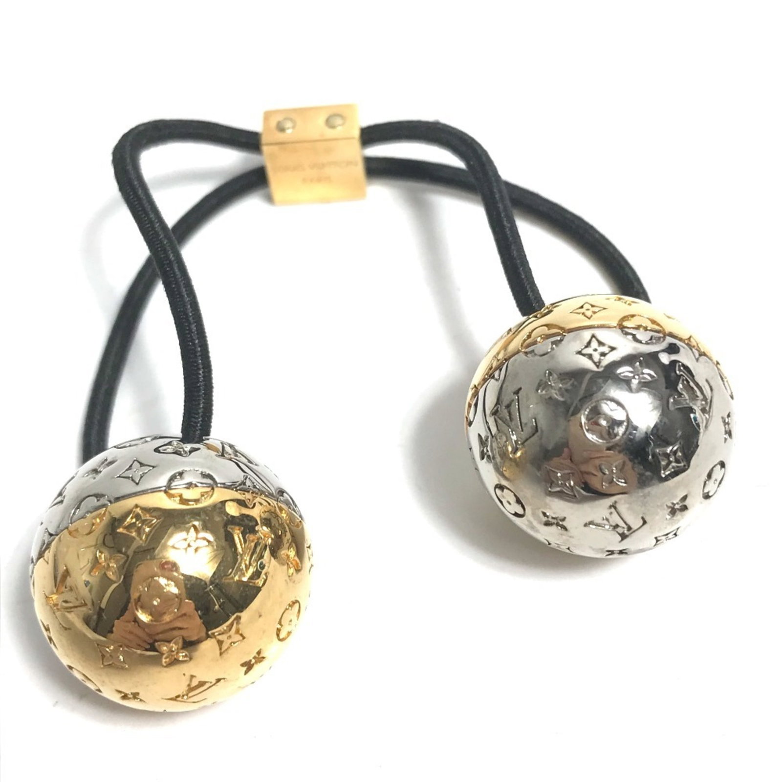 Hair Tie Metal Louis Vuitton: Hair Tie Metal Louis Vuitton Metal Louis Vuitton Hair Tie in Gold or Silver. This metal hair tie features the iconic Louis Vuitton design, showcasing the brand's signature style. Made from metal, the
