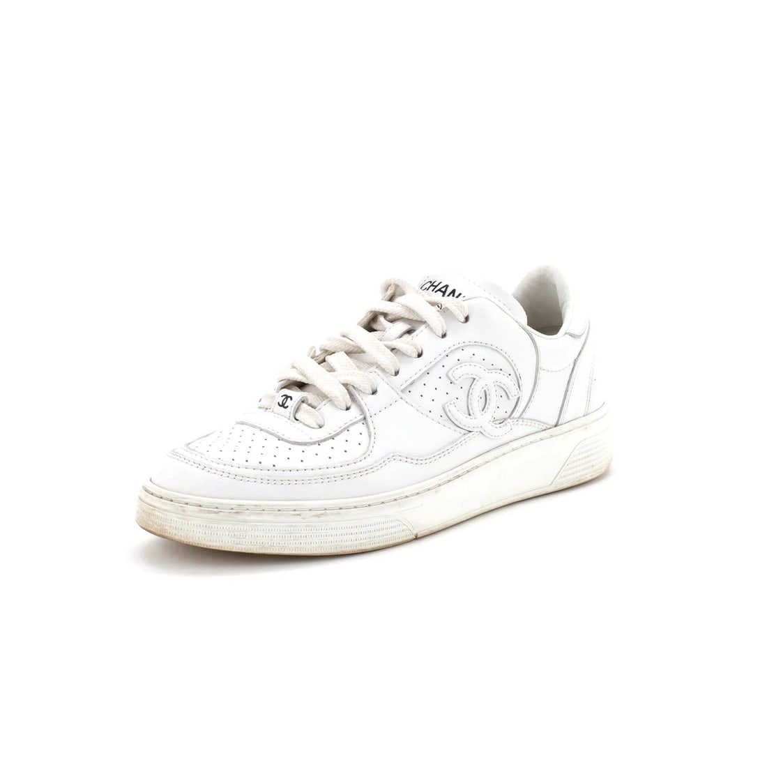 Chanel Low-Top Perforated Leather CC Women's Sneakers: Chanel Low-Top Perforated Leather CC Women's Sneakers Chanel's iconic CC logo takes center stage on these sleek, perforated leather low-top sneakers. With a crisp white exterior and black, white