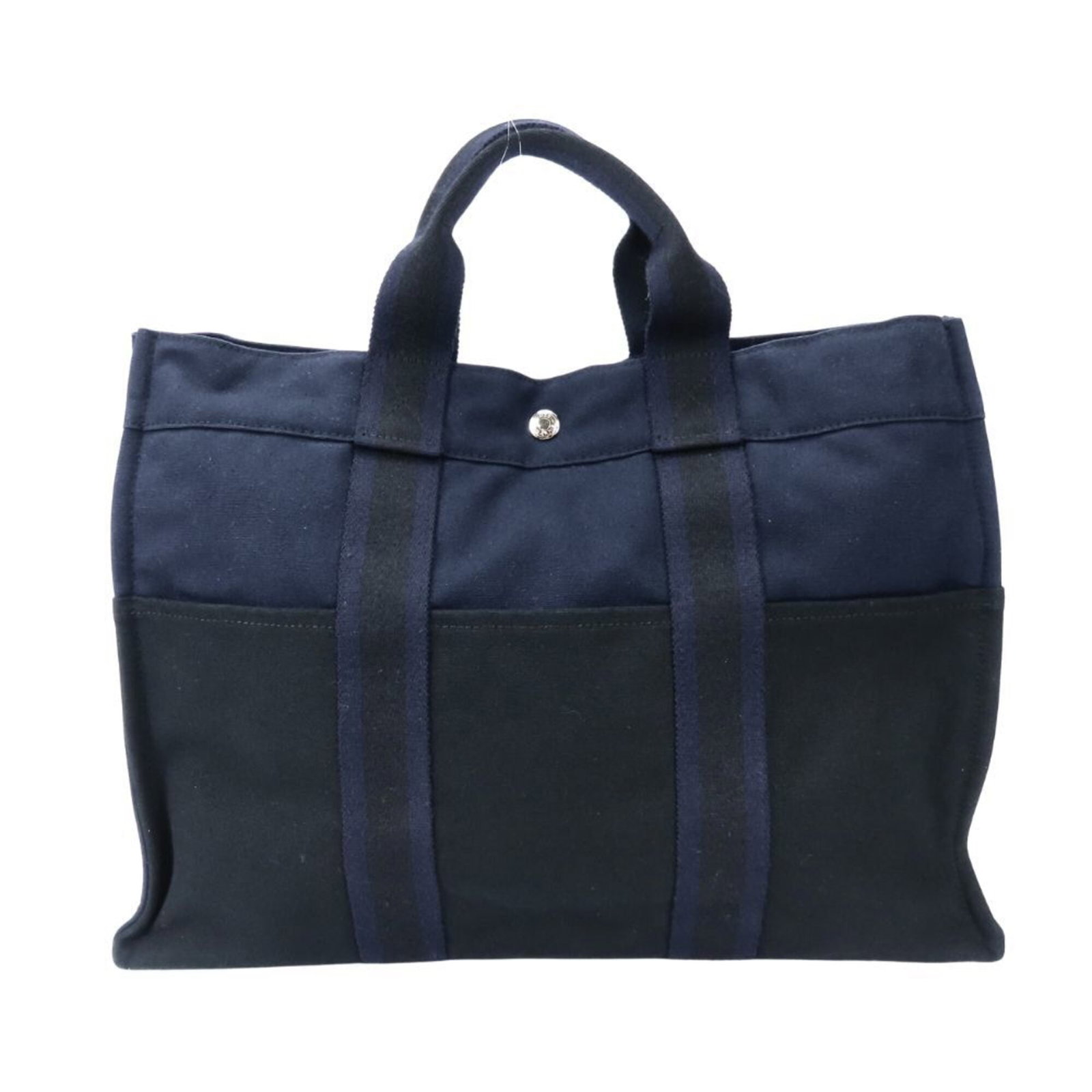 Canvas tote bag Hermes: Canvas tote bag Hermes Canvas tote bag from Hermes, made from high-quality canvas material, features a sleek black and navy color combination. Measuring 31cm x 42.5cm x 10cm, this tote bag is a stylis