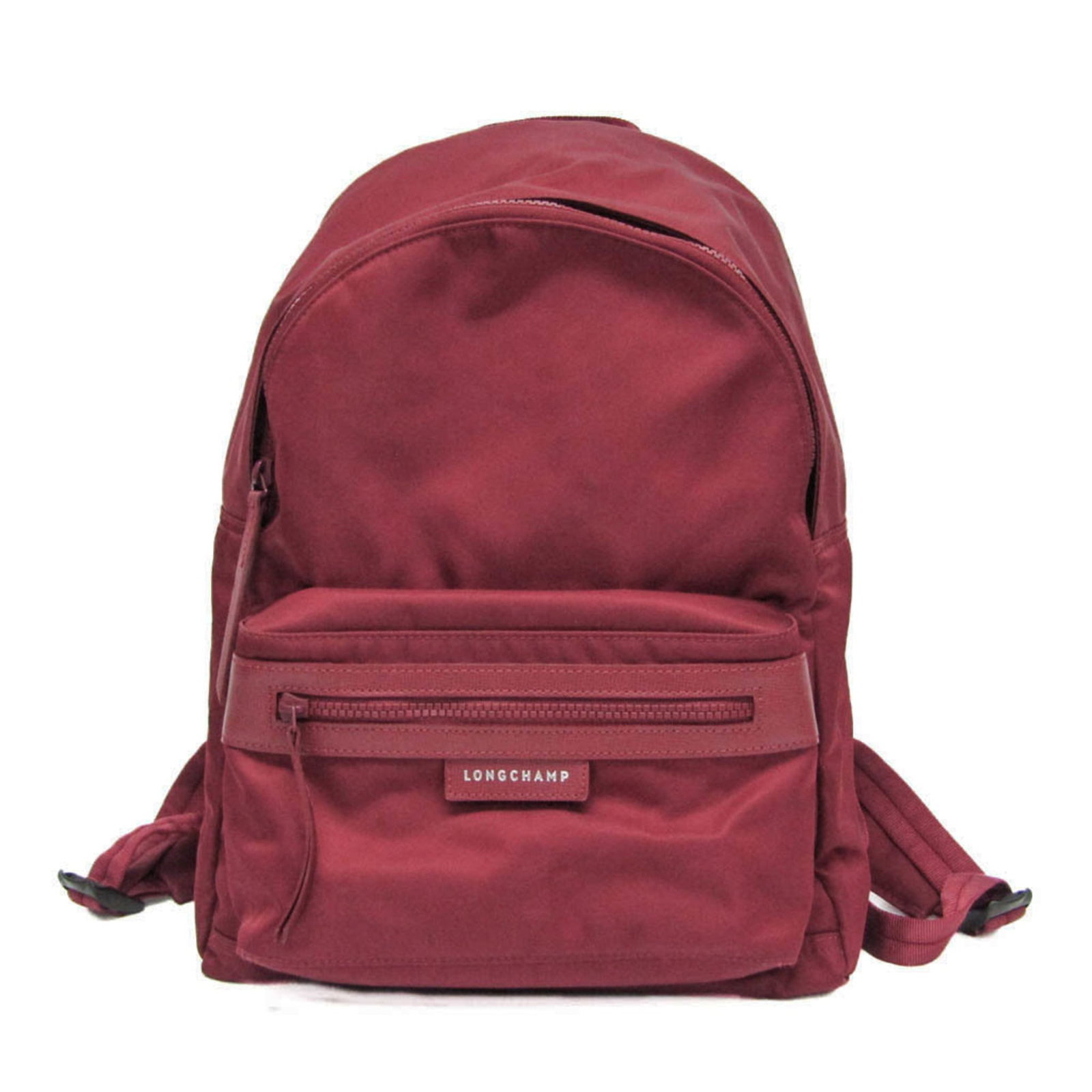 Nylon Backpack Longchamp: Nylon Backpack Longchamp Nylon Backpack Longchamp features a sleek Bordeaux color and a practical design with two zippered pockets, one inner and one outer, for organized storage. The backpack