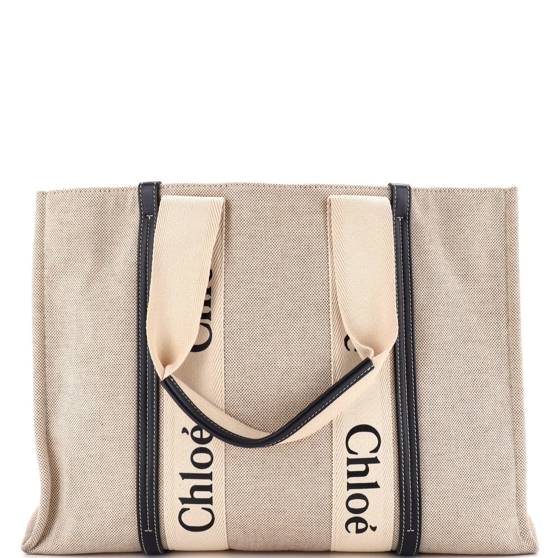 Large Canvas Tote with Leather Chloe: Large Canvas Tote with Leather Chloe Canvas tote with a striking combination of plain canvas and high-quality leather, adding a touch of sophistication to any daily routine. The neutral exterior
