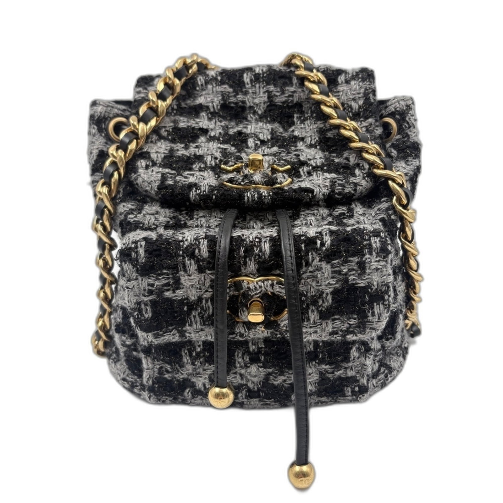 Backpack by Chanel: Backpack by Chanel Clear, Gray Chanel Backpack with Classic Design. This sleek backpack boasts a clear and gray color combination, measuring 26cm x 26cm x 9cm. Its timeless design makes it a stylish