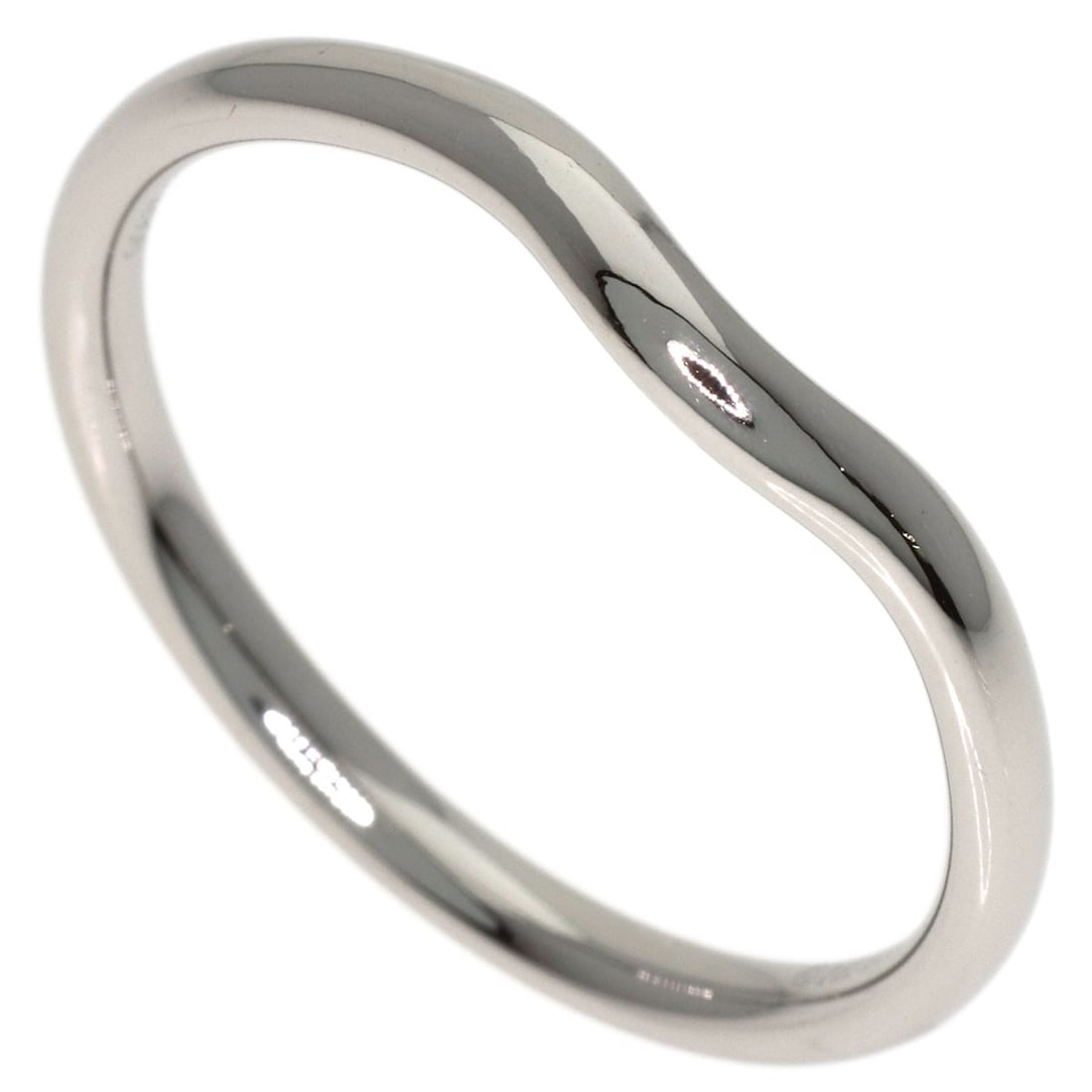 Tiffany Co Platinum Ring Band Curved: Tiffany Co Platinum Ring Band Curved Platinum band from Tiffany & Co. features a curved design and a silver PT950 metal construction. The ring is available in a size 9.75 and does not include a main s