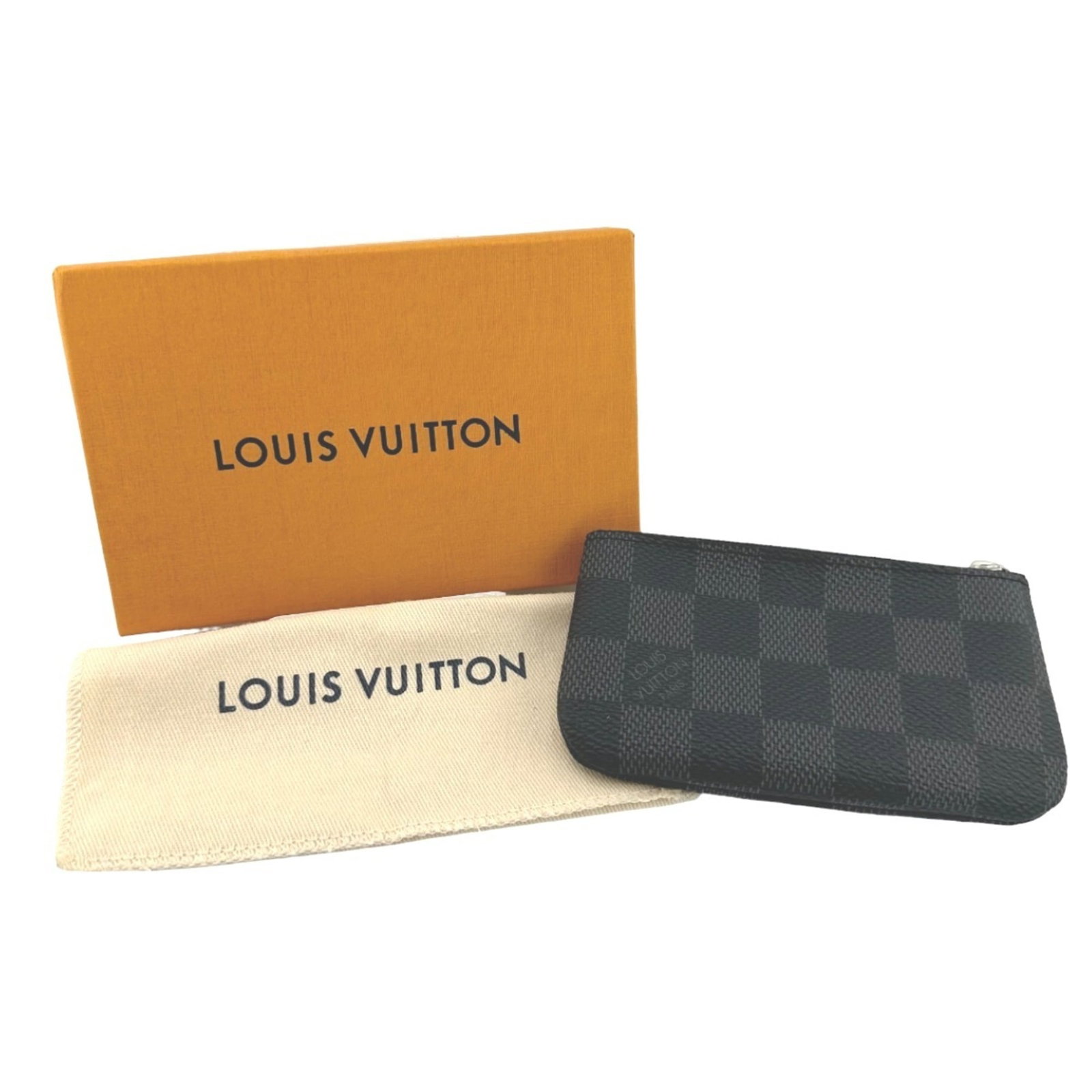 Louis Vuitton Coin Purse/ Coin Case Damier Graphite: Louis Vuitton Coin Purse/ Coin Case Damier Graphite Damier Graphite Coin Purse/ Coin Case by Louis Vuitton. This stylish coin purse features the iconic Damier Graphite pattern, a classic design elemen