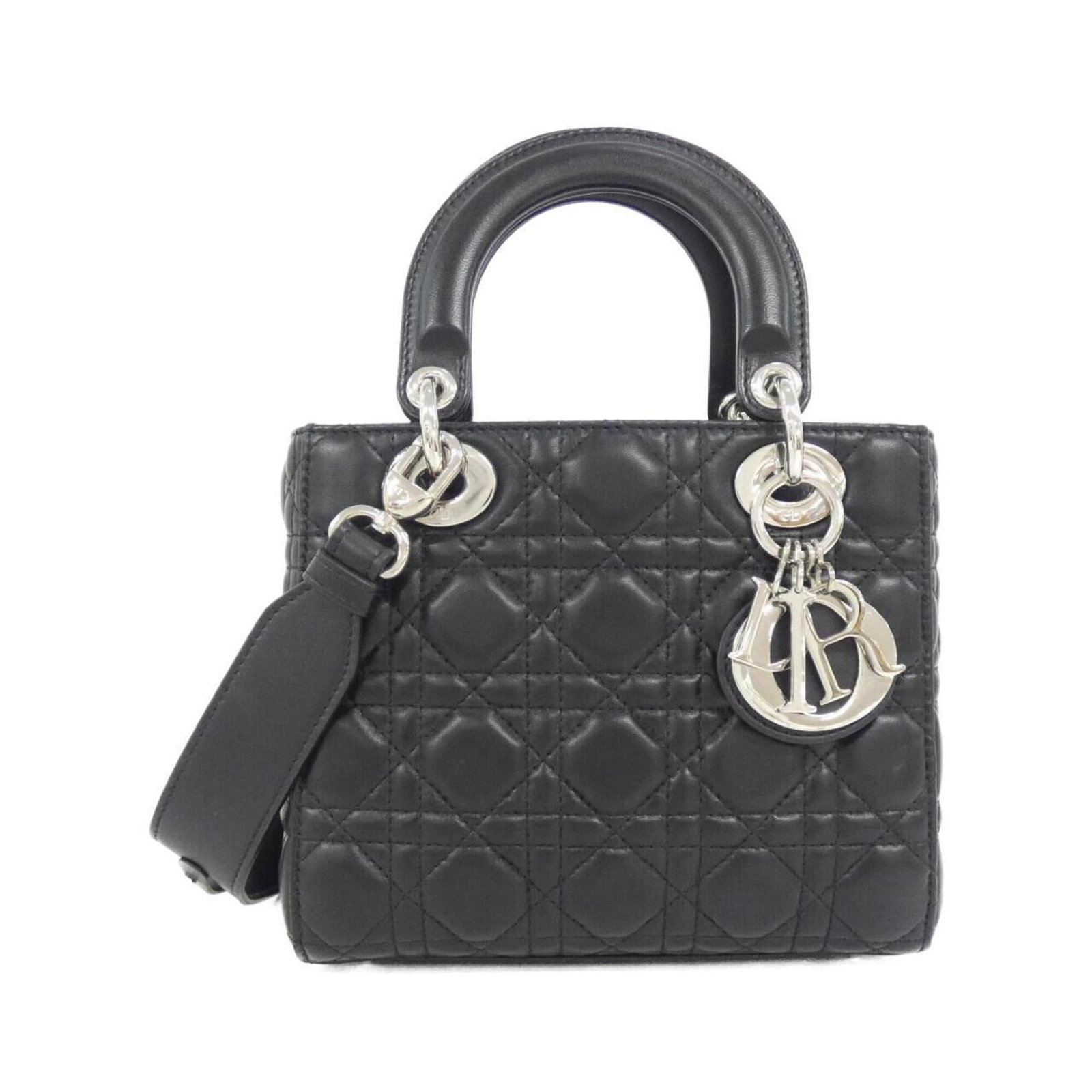 Handbag Leather Dior Christian: Handbag Leather Dior Christian This luxurious handbag is crafted from high-quality lambskin leather, featuring a sleek black finish. Measuring 17cm x 20cm x 8cm, it boasts a stylish design that