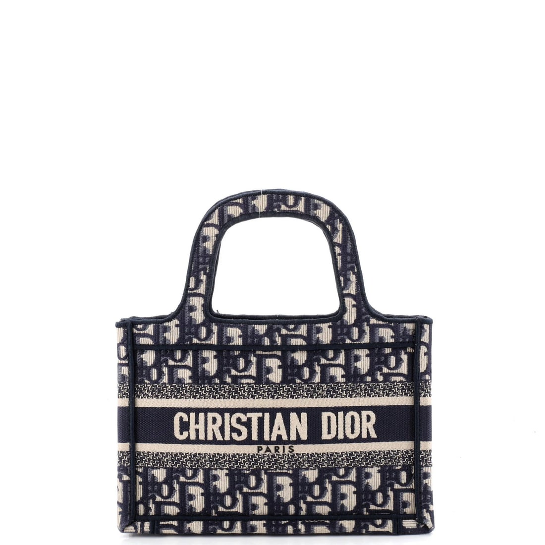 Mini Canvas Oblique Book Tote Dior Christian: Mini Canvas Oblique Book Tote Dior Christian Mini Canvas Oblique Book Tote Dior Christian in blue, featuring a canvas exterior with a classic oblique design, measuring 6" high and 9" wide, with a 3"