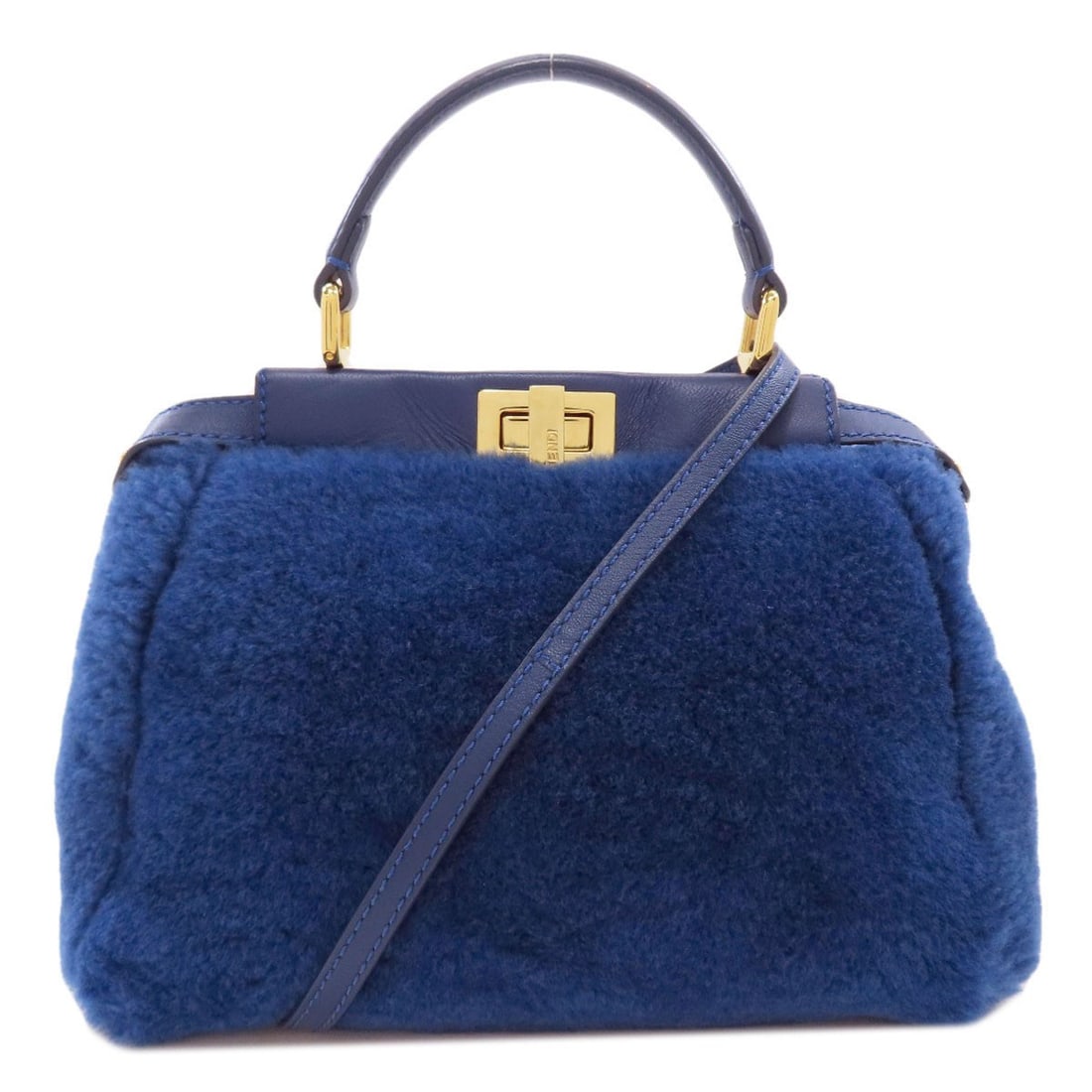 Fur Peekaboo 2Way Handbag Fendi Mini: Fur Peekaboo 2Way Handbag Fendi Mini Fur Peekaboo 2Way Handbag Fendi Mini in a stunning blue hue, featuring a sleek 7.5 inch height and 3.9 inch depth. The detachable strap and luxurious fur exterior 