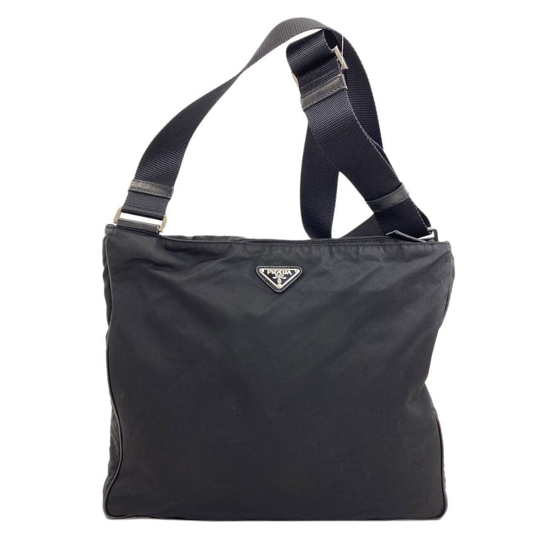 Shoulder Bag Nylon Prada Hardware Logo: Shoulder Bag Nylon Prada Hardware Logo Black nylon shoulder bag with Prada hardware logo. Made from durable nylon, this style features a sleek and modern design. The Prada hardware logo adds a touch o