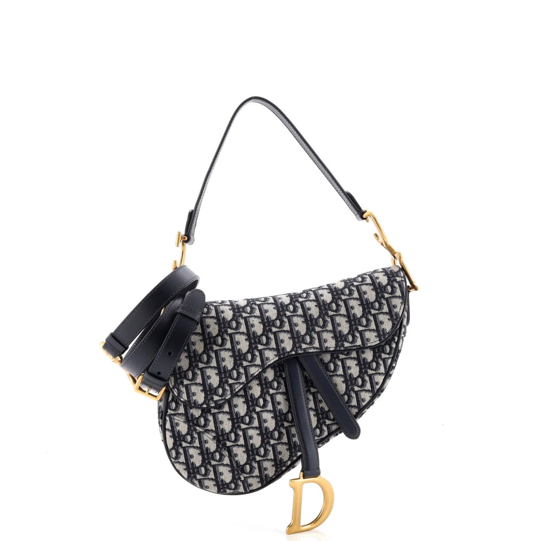Saddle Handbag Strap Oblique Canvas Medium Christian Dior: Saddle Handbag Strap Oblique Canvas Medium Christian Dior Saddle Handbag with Strap Oblique Canvas Medium from Christian Dior features a striking blue canvas exterior with oblique design,