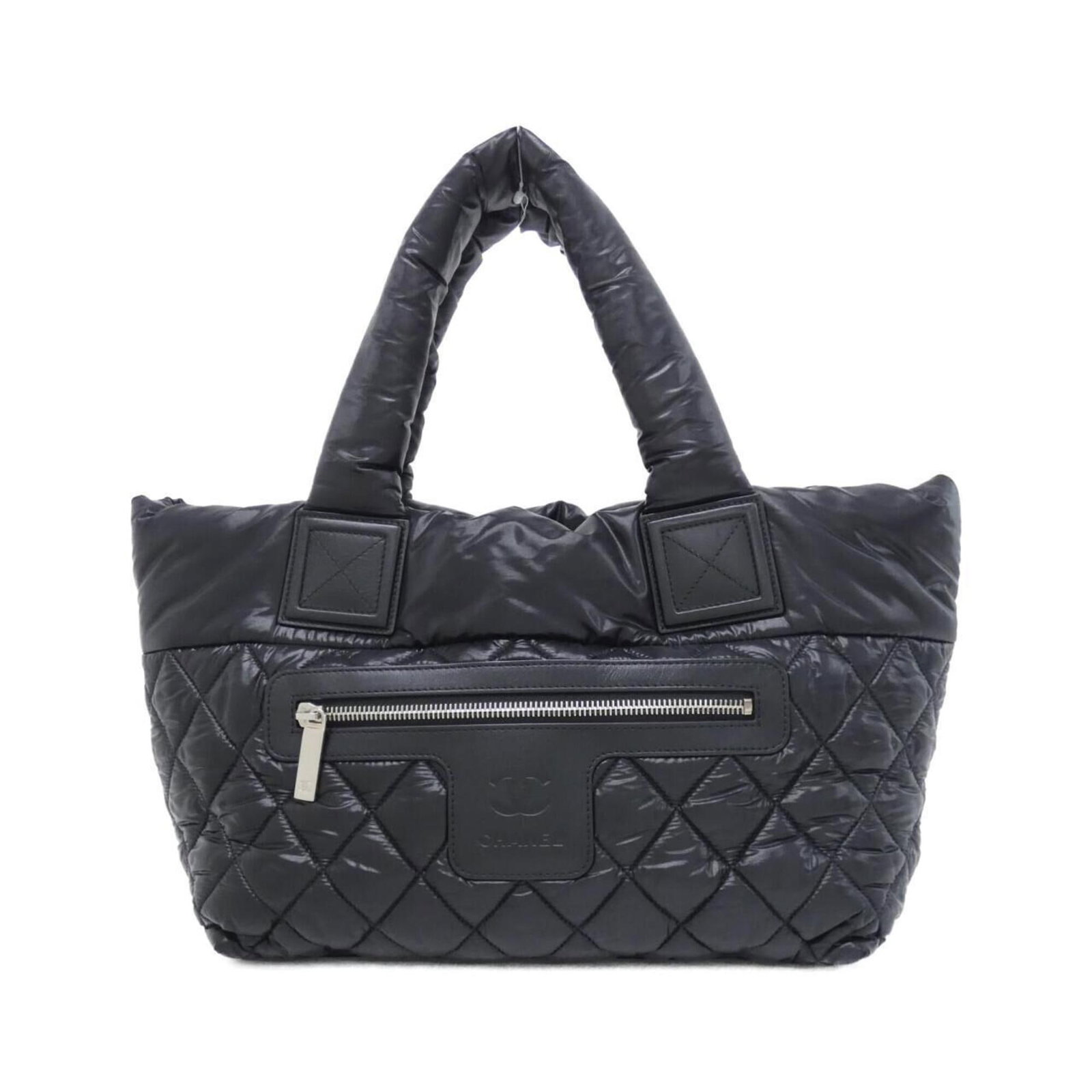 Nylon Handbag Chanel: Nylon Handbag Chanel Nylon Handbag Chanel is made from durable nylon material, featuring a sleek black color and silver hardware. The bag measures 24cm x 41cm x 15cm, making it a compact and stylish