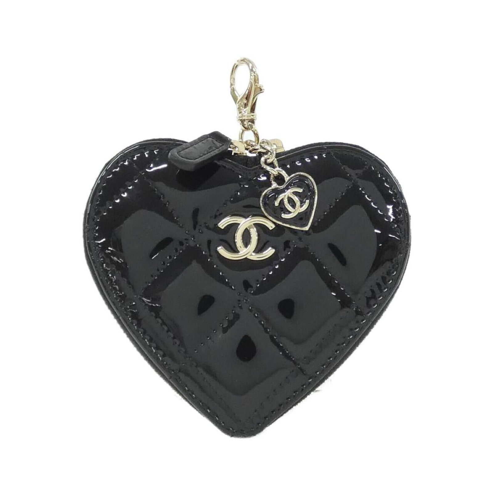 Coin purse in leather case: Coin purse in leather case The sleek leather case of this Chanel coin purse is a timeless accessory, featuring a classic design and elegant black color. Made from high-quality leather, this compact ca