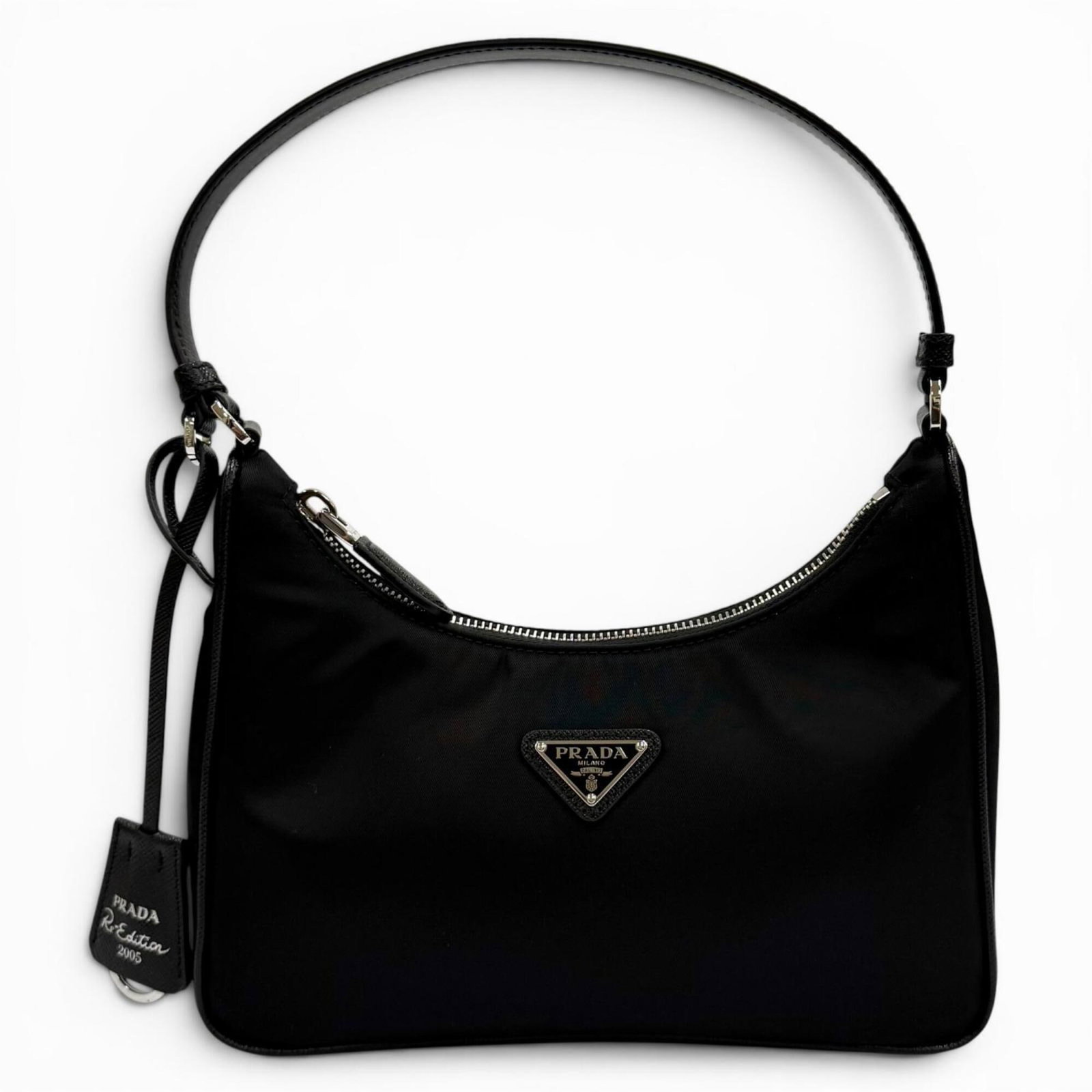 Nylon Prada Handbag: Nylon Prada Handbag Item Specifics: Brand: Prada Country of Origin: Italy Type: Handbag Material: Nylon Color: Black Gender: Women Size (HxWxD): 17cm x 22cm x 6cm / 6.69'' x 8.66'' x 2.36'' Product