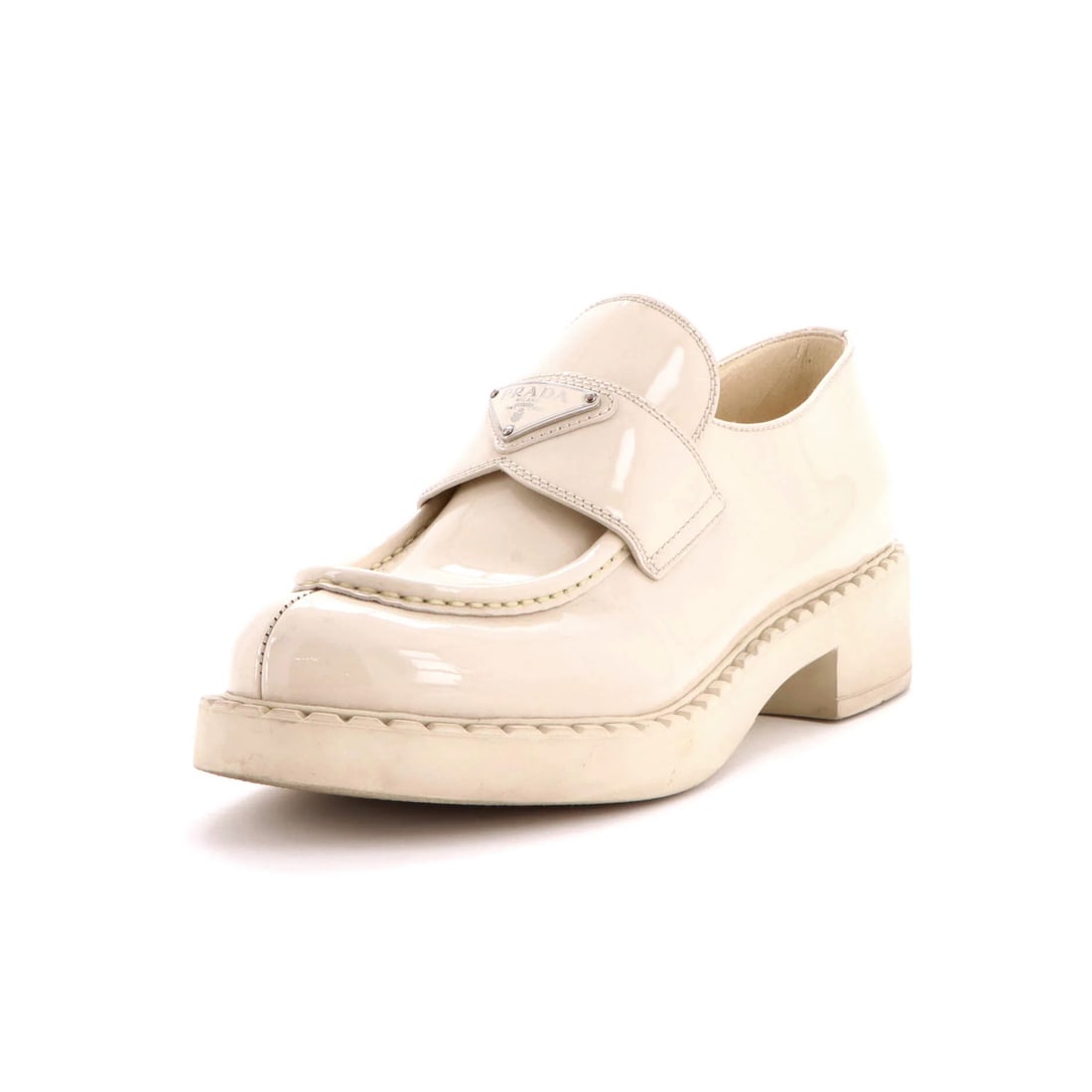 Patent Platform Loafers Triangle Women's Logo Prada: Patent Platform Loafers Triangle Women's Logo Prada Patent Platform Loafers from Prada feature a neutral upper made of patent leather, adding a touch of sophistication to any outfit. The shoes boast