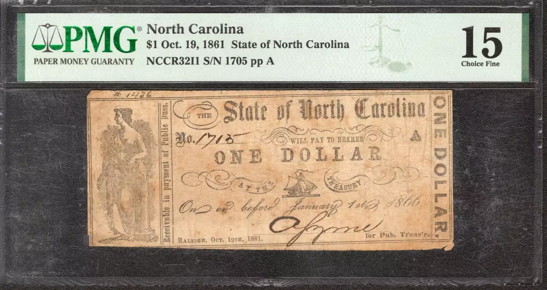 1861 $1 STATE OF NORTH CAROLINA RALEIGH RARITY 10 OBSOLETE NOTE PMG 15 FINE (082: 1861 $1 STATE OF NORTH CAROLINA RALEIGH RARITY 10 OBSOLETE NOTE PMG 15 FINE (082 The 1861 $1 State of North Carolina note is a rare and unique piece of American history, featuring a PMG 15 Fine grade 