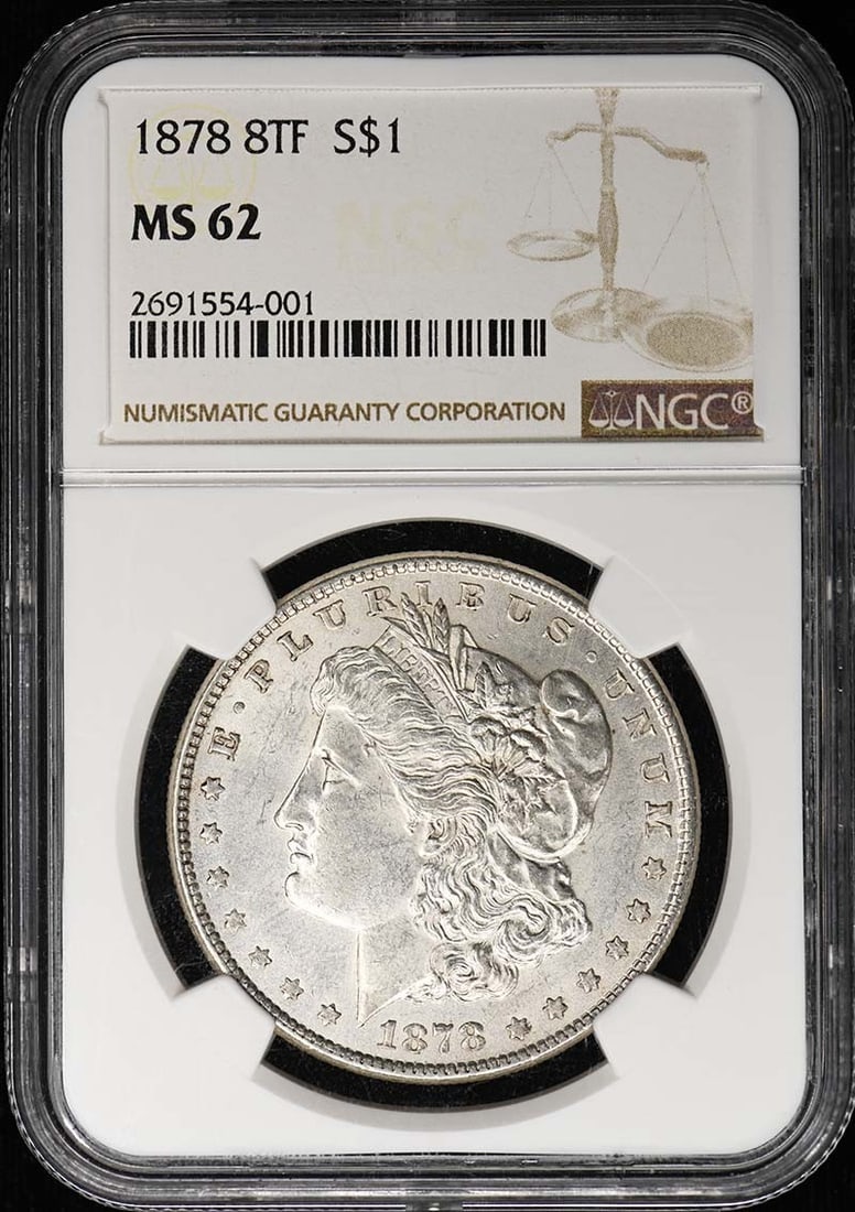 Morgan Dollar S$1 MS62 NGC 8TF 1878: Morgan Dollar S$1 MS62 NGC 8TF 1878 MS62 graded Morgan Dollar from 1878, certified by the NGC, boasts a high level of detail and luster. The coin's circulated status is evident in its MS62 grade, indi