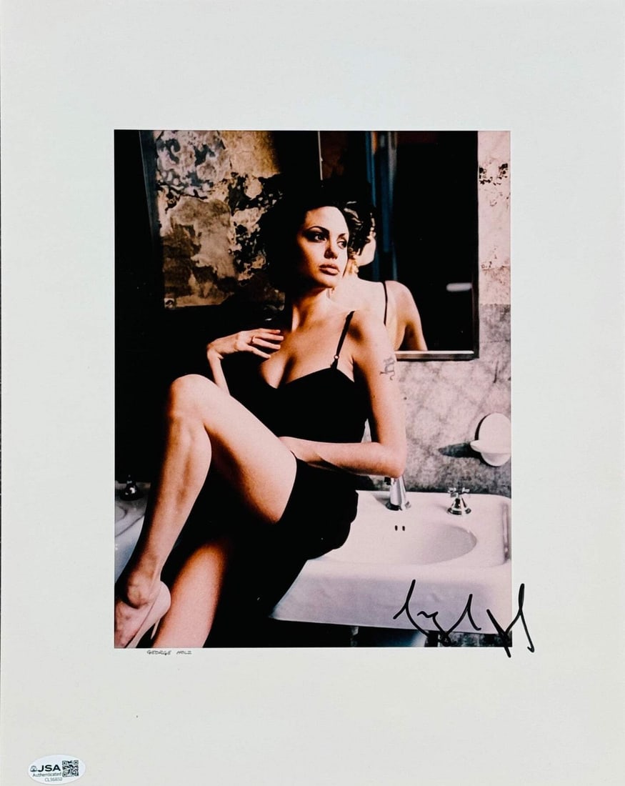 Angelina Jolie Autographed 11x14 Celebrity Photo (JSA): Angelina Jolie Autographed 11x14 Celebrity Photo (JSA) Authentic Angelina Jolie 11x14 Celebrity Photo, signed in black sharpie by the actress across the front of the photo. This photo is verified by J