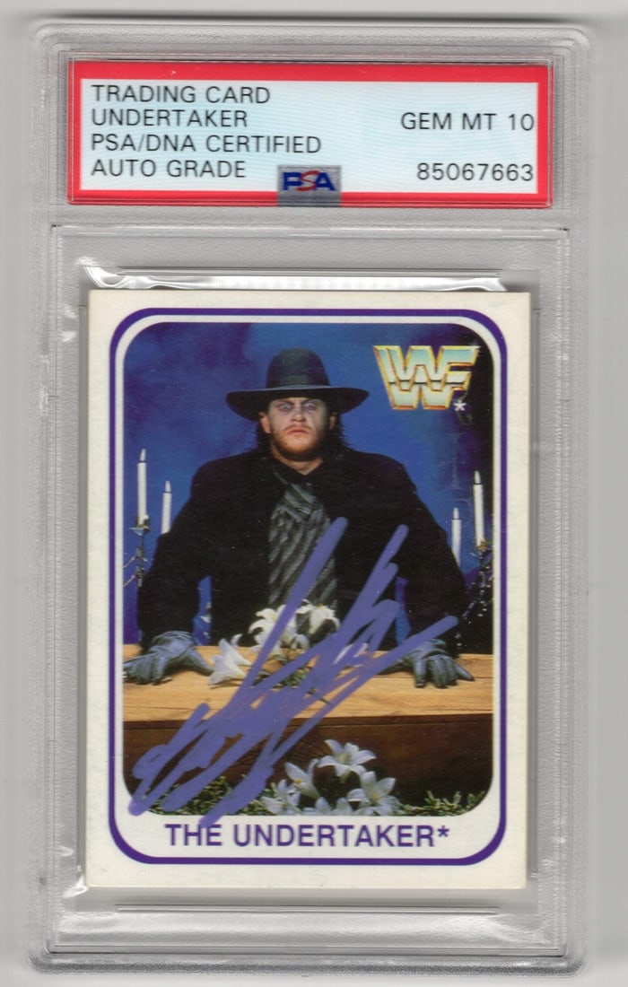 Undertaker Autographed 1991 WF Merlin #103 Card PSA Auto Grade GEM MT 10: Undertaker Autographed 1991 WF Merlin #103 Card PSA Auto Grade GEM MT 10 Signed in purple paint pen, the Undertaker's 1991 WF Merlin #103 card boasts a unique autograph that collectors will appreciate