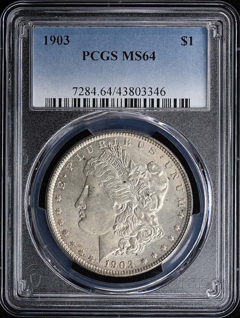 1903 $1 Morgan Dollar PCGS MS64: 1903 $1 Morgan Dollar PCGS MS64 The 1903 $1 Morgan Dollar is a highly sought-after coin, graded MS64 by the PCGS, indicating a high level of preservation and detail. This uncirculated coin features th