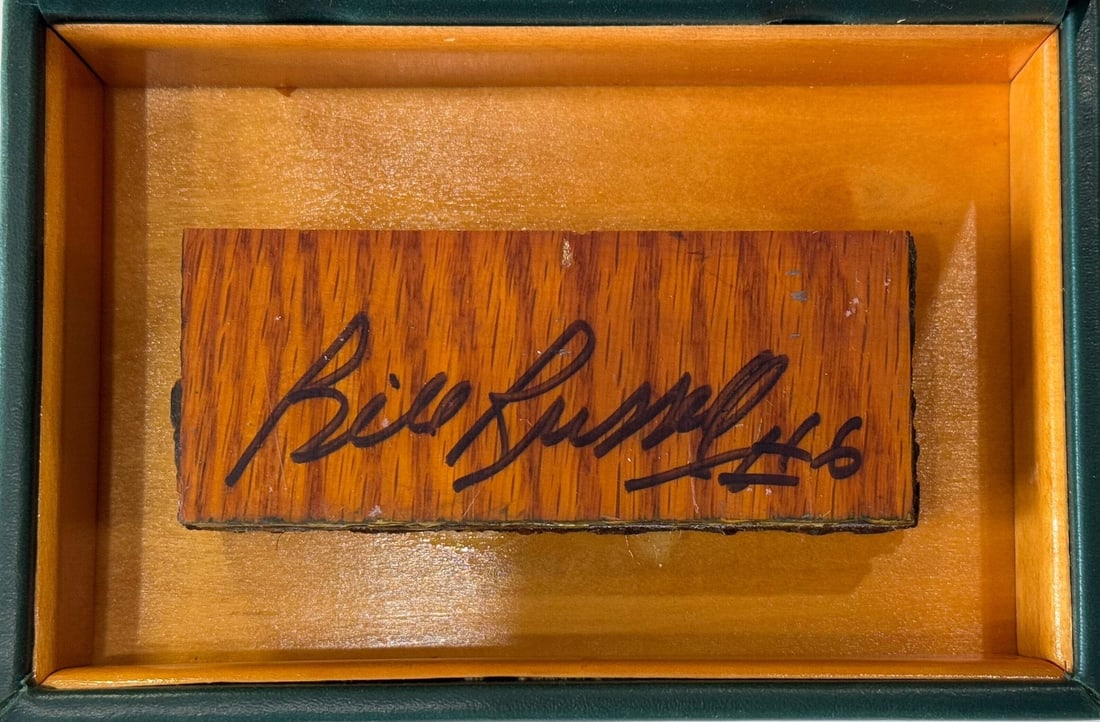 Russell Bill Autographed 4x2 Boston Floor Garden Piece: Russell Bill Autographed 4x2 Boston Floor Garden Piece The iconic 4x2 Boston Garden floor piece, signed by Russell Bill in black sharpie on the front, is a unique collectible featuring a Boston Garden