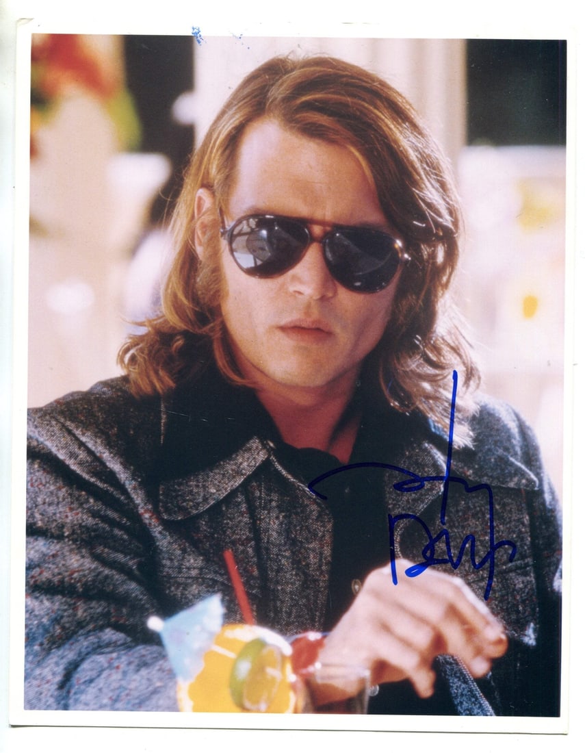 Johnny Depp Autographed 8x10 Celebrity Photo: Johnny Depp Autographed 8x10 Celebrity Photo Johnny Depp's blue sharpie signature adds a touch of authenticity to this 8x10 celebrity photo, capturing his iconic presence. The photo itself is a classi