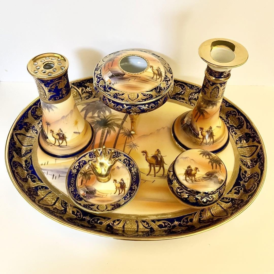 Noritake Man On Camel Table Set 6 Pieces Cobalt Gold Antique Porcelain 1910s: Noritake Man On Camel Table Set 6 Pieces Cobalt Gold Antique Porcelain 1910s Item Specifics: Origin: Japan Pattern: Camel and Desert Scene Color: Cobalt Blue Gold Orange Material: Porcelain Brand: Nor