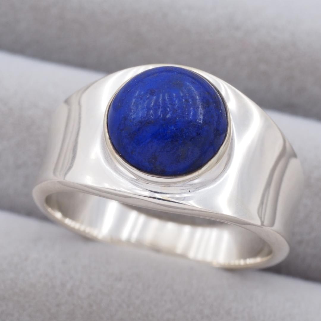 Rare US9 Sterling Silver Wide Lapis Lazuli Ring by Georg Jensen No.124: Rare US9 Sterling Silver Wide Lapis Lazuli Ring by Georg Jensen No.124 Item Specifics: Color: Silver Main Stone Color: Blue Material: Metal Metal: Sterling Silver Main Stone: Lapis Lazuli Ring Size: 9