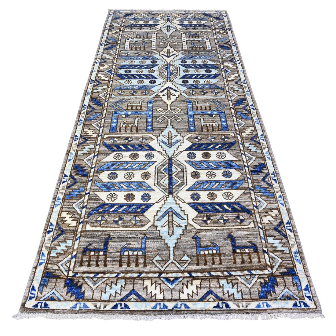 Hand knotted Gray Village Triangles Wool Rug 4'1 x9'10: Hand knotted Gray Village Triangles Wool Rug 4'1 x9'10 Hand-knotted in traditional Anatolian style, this 4'1" x 9'10" wool runner rug boasts a stunning grey field with intricate regional design. Made 