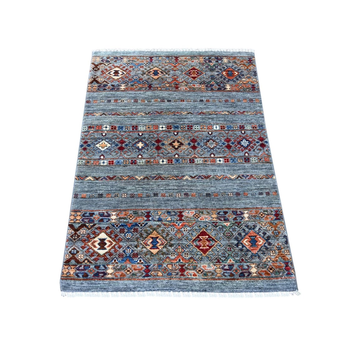 3'1"x4'3" Gray Afghan Super Kazak Hand Knotted Wool Sample Mat Rug: 3'1"x4'3" Gray Afghan Super Kazak Hand Knotted Wool Sample Mat Rug The 3'1"x4'3" Gray Afghan Super Kazak Hand Knotted Wool Sample Mat Rug is a stunning example of traditional Afghan craftsmanship, fea