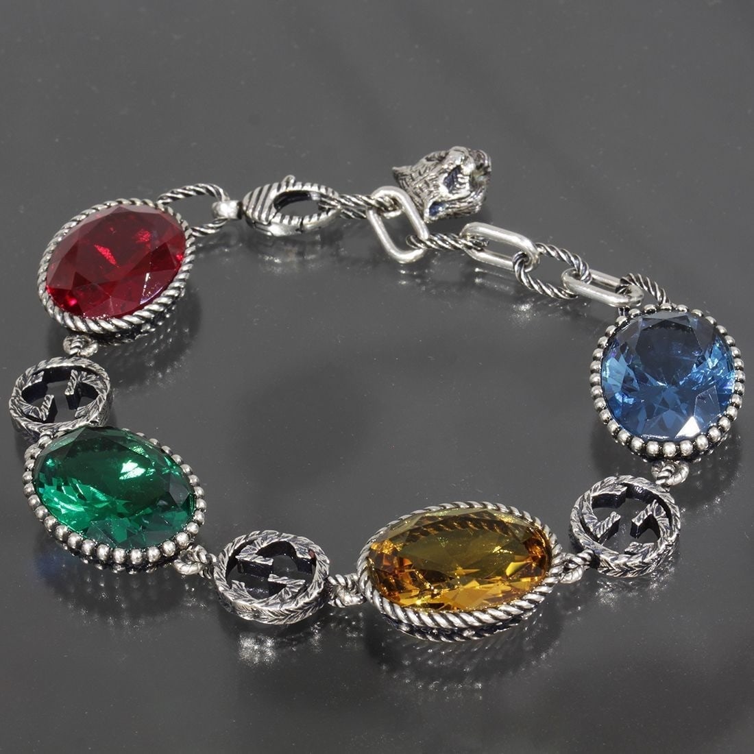 Gucci Interlocking G Red, Yellow, Blue, Green Multicolored Stone bracelet bangle: Gucci Interlocking G Red, Yellow, Blue, Green Multicolored Stone bracelet bangle Item Specifics: Brand: Gucci Type: Bracelet Metal Purity: 925 Color: Silver Style: Chain Base Metal: Sterling Silver Ma