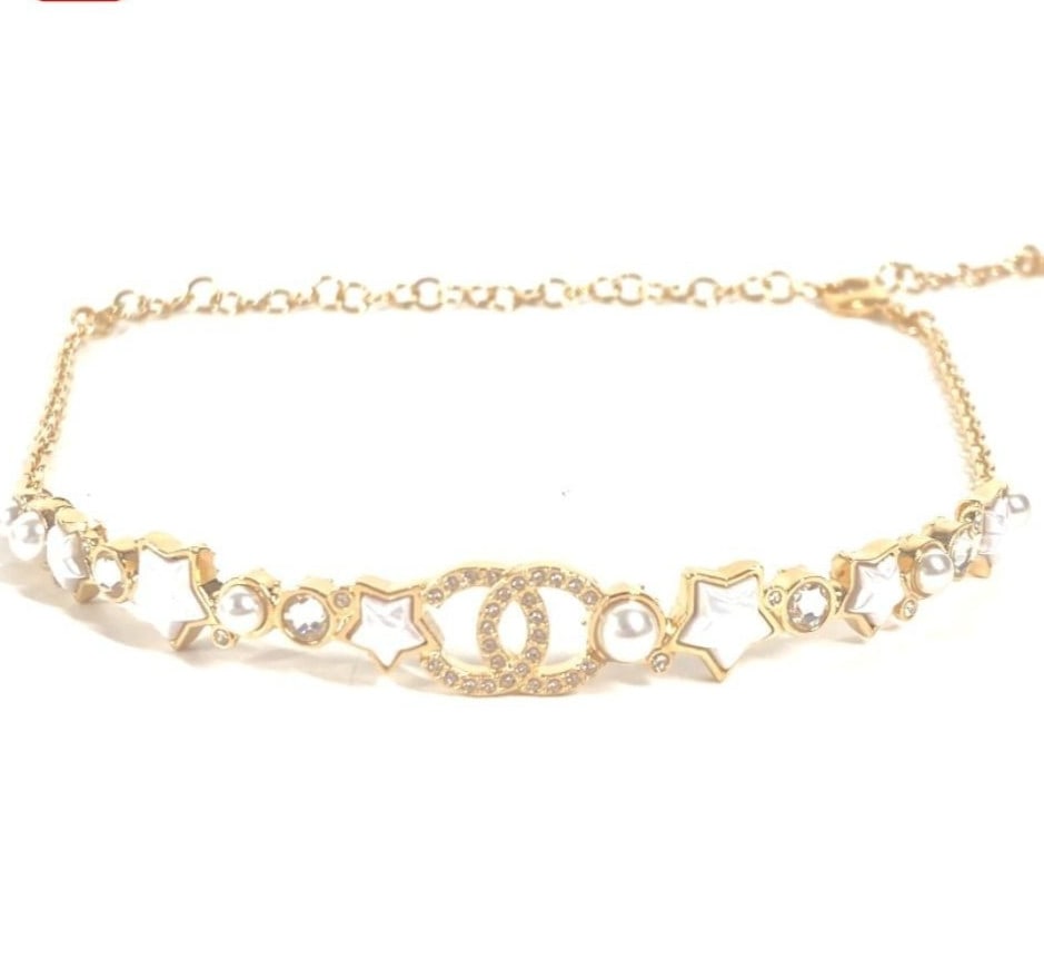 Coco Chanel B24 CC Star Motif Necklace Chain Choker Gold Tone Box: Coco Chanel B24 CC Star Motif Necklace Chain Choker Gold Tone Box Item Specifics: Brand: CHANEL Type: Necklace Color: Gold Style: Choker Material: Metal Main Stone Color: Clear Main Stone: rhinestone 