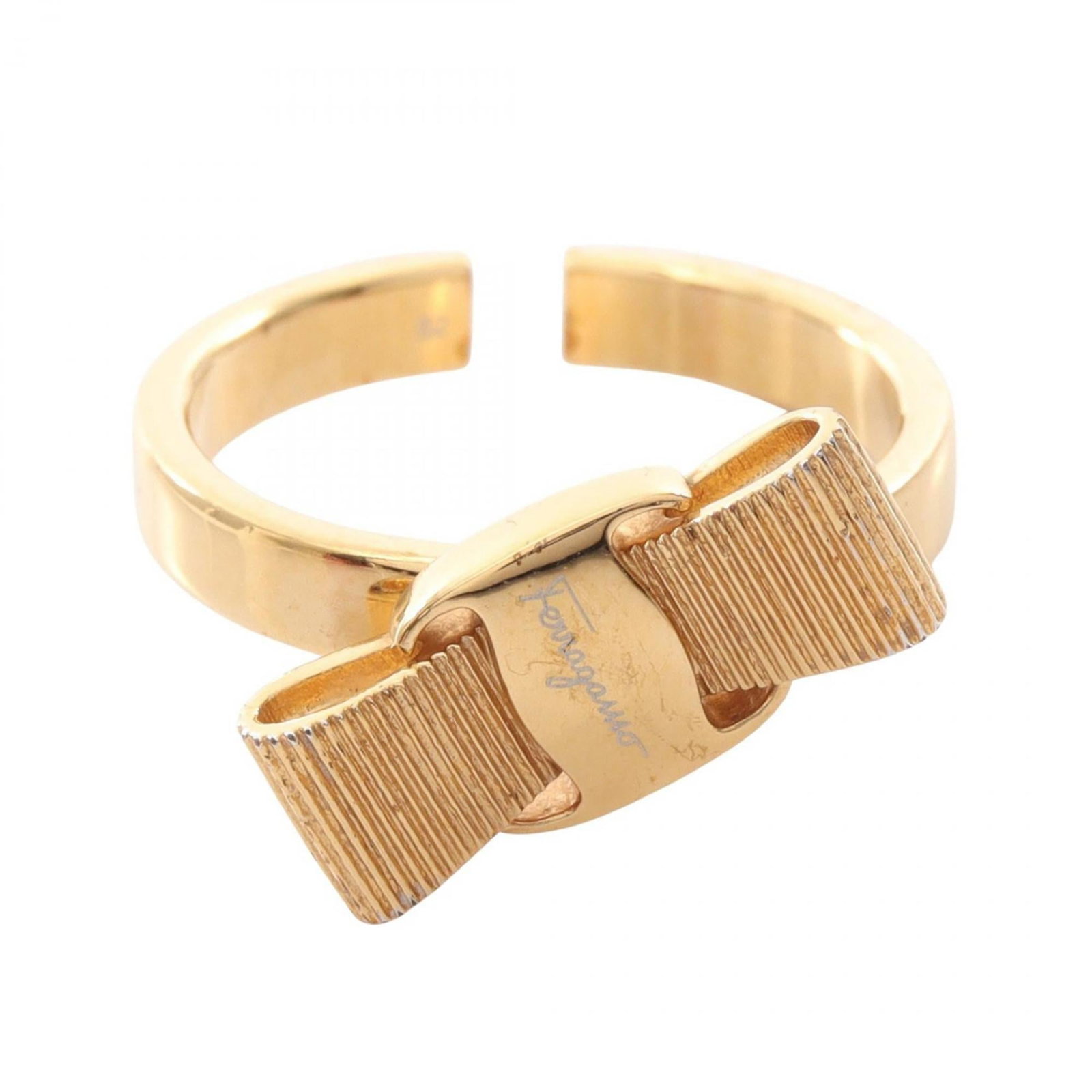 SALVATORE FERRAGAMO Band Ring Gold Plating: SALVATORE FERRAGAMO Band Ring Gold Plating Gold plating gives this Salvatore Ferragamo band ring a sleek, sophisticated look. The ring features a classic band design with visible wear and scratches, g