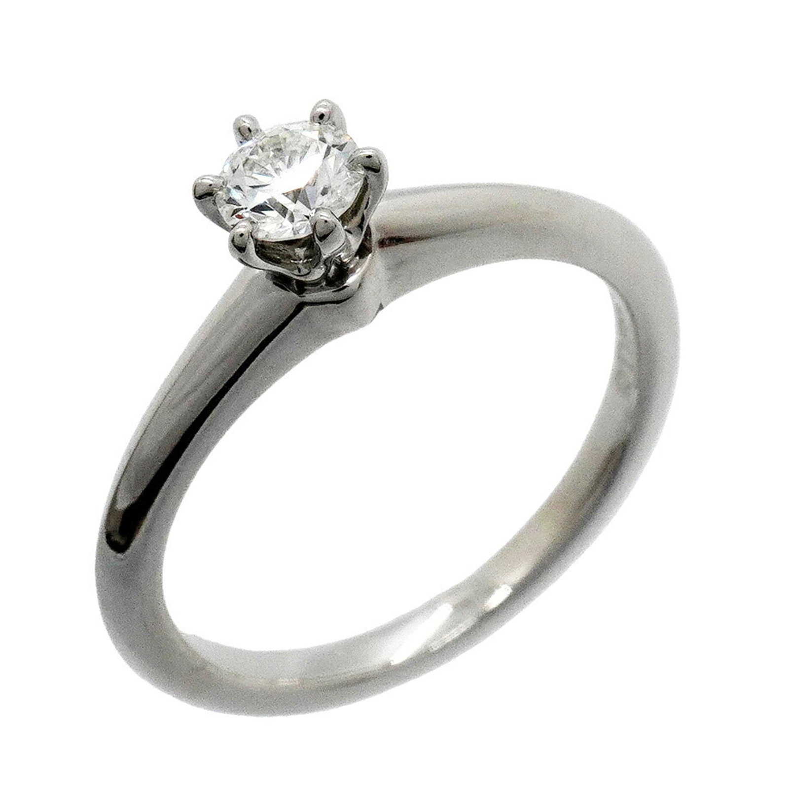 TIFFANY Band Ring Platinum 950: TIFFANY Band Ring Platinum 950 Platinum 950 Tiffany band ring with a diamond stone, this 4.5 US size ring features visible scratches and scuffs from normal wear. The ring is made of high-quality plati