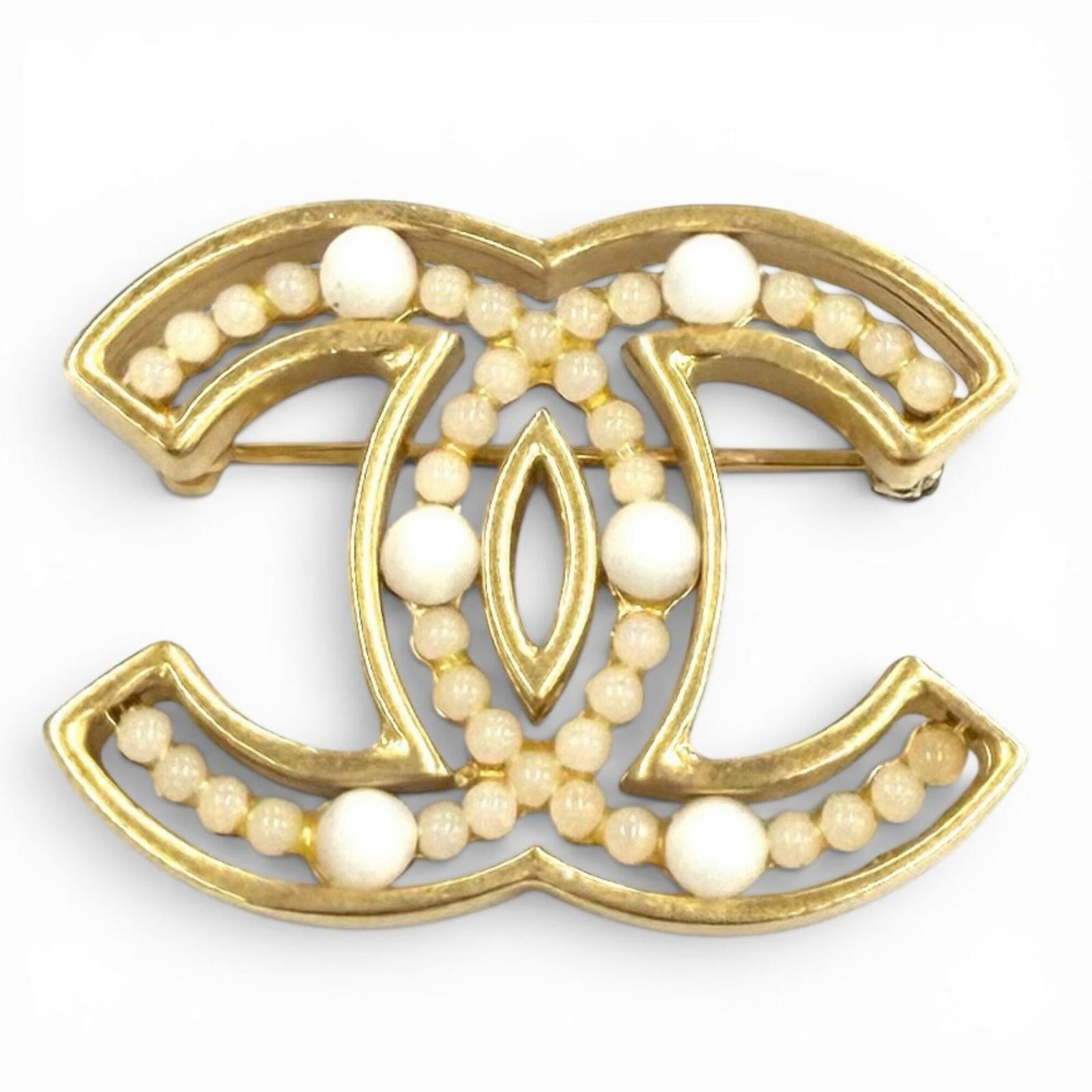 CHANEL Brooch Gold White: CHANEL Brooch Gold White Gold and white Chanel brooch, 3cm x 4cm in size, in like new condition with no visible wear. The brooch is refurbished and functions as new, with the faintest traces of previo