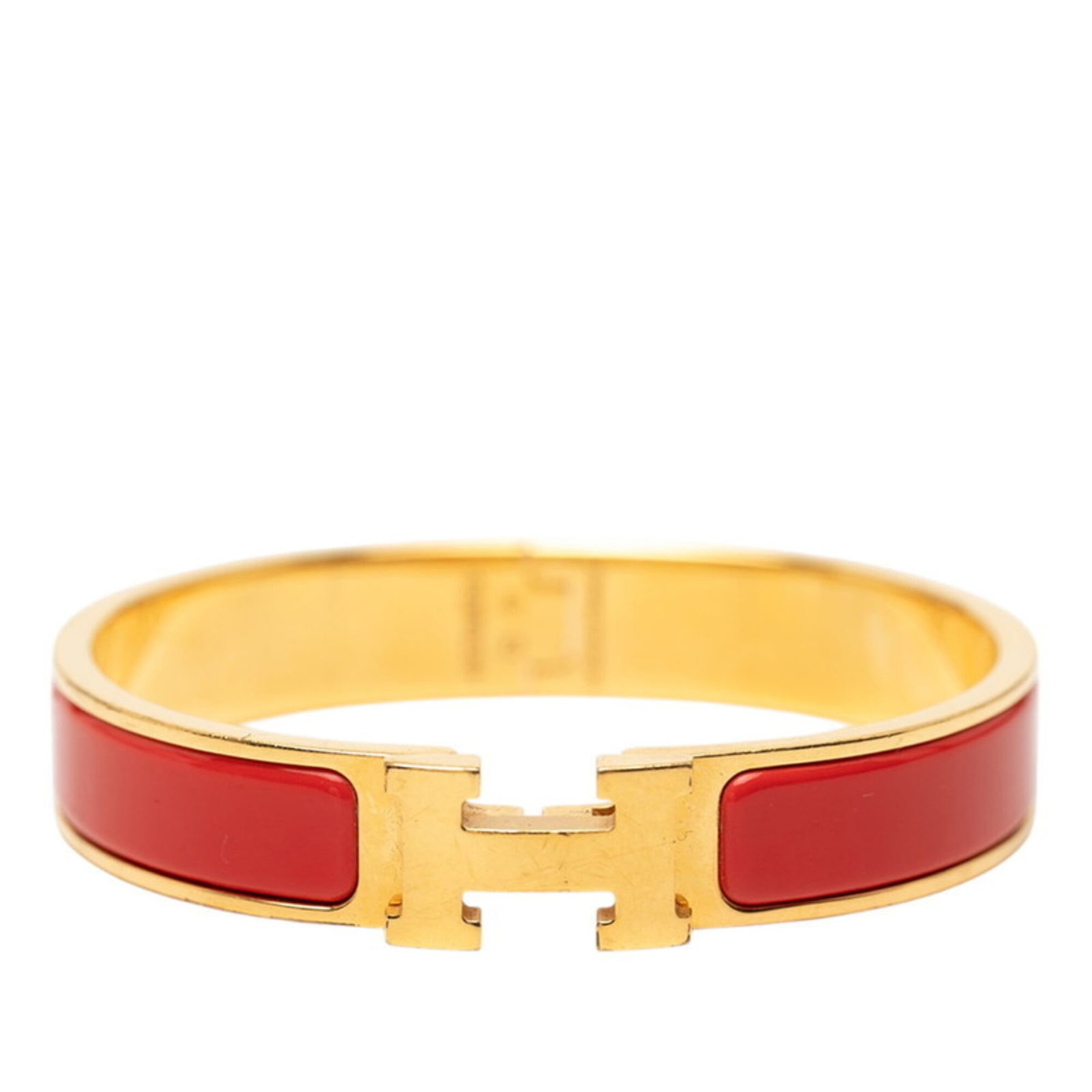 HERMES Charm Bracelet Gold Red Color: HERMES Charm Bracelet Gold Red Color Gold Red Color Charm Bracelet from Hermes, a classic style with a pop of vibrant red, available in a 19.5cm length. The item features visible wear, scratches, and