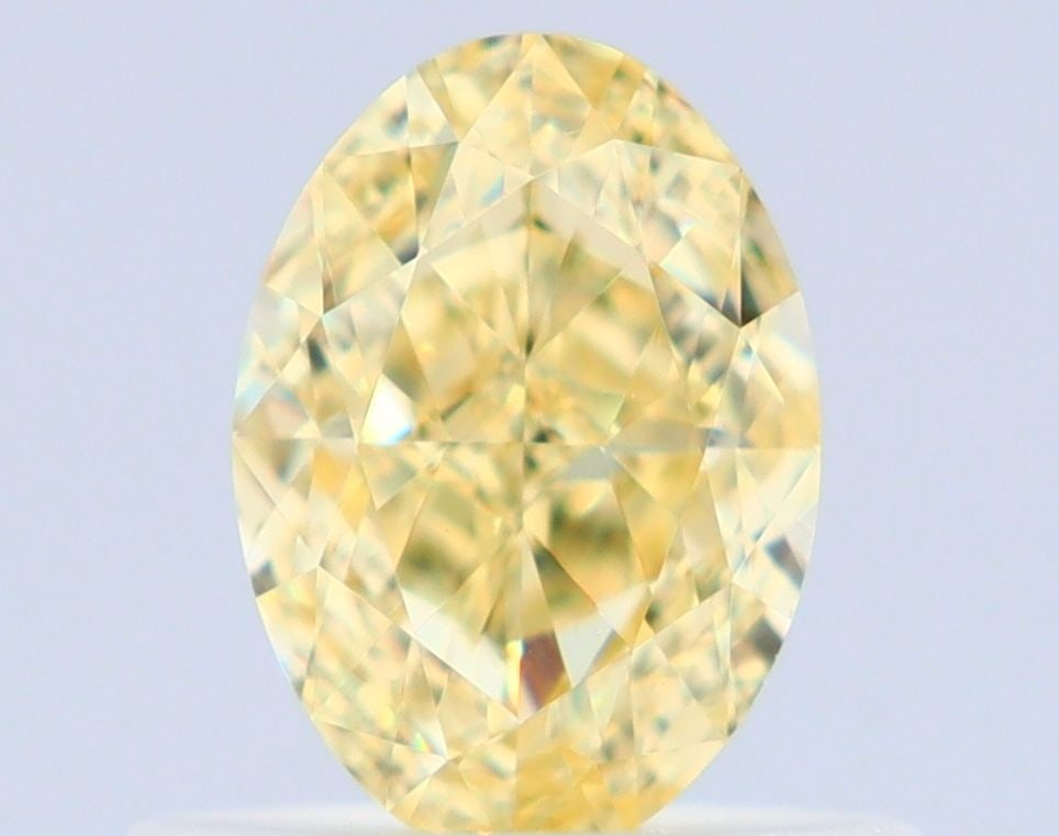GIA Oval 0.66ct Fancy Yellow VVS1 - Loose Natural Diamond: GIA Oval 0.66ct Fancy Yellow VVS1 - Loose Natural Diamond GIA Oval 0.66ct Fancy Yellow VVS1 - Loose Natural Diamond. This oval-cut diamond boasts a vibrant Fancy Yellow color and exceptional clarity, 