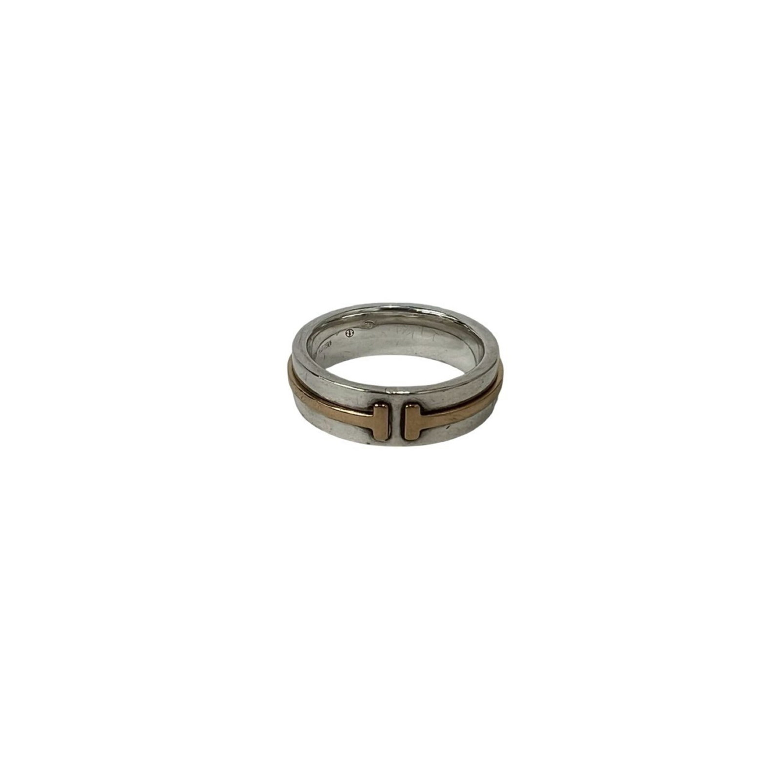 TIFFANY Band Ring Silver 925 Yellow Gold (18K): TIFFANY Band Ring Silver 925 Yellow Gold (18K) Silver 925 band ring with a touch of 18K yellow gold, adding a subtle warmth to its sleek design. The ring features a classic Tiffany style, with a subtl