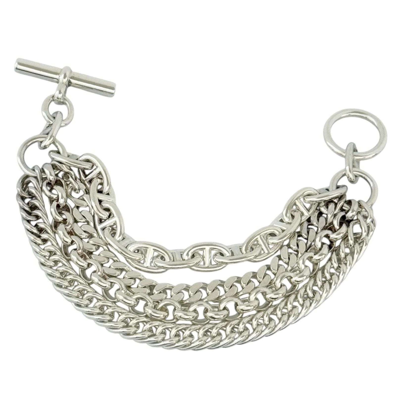 HERMES Charm Bracelet Silver 925: HERMES Charm Bracelet Silver 925 Silver 925 Charm Bracelet from Hermes, crafted in France, features a delicate 15cm length with minor signs of wear. Gently used, the bracelet showcases small