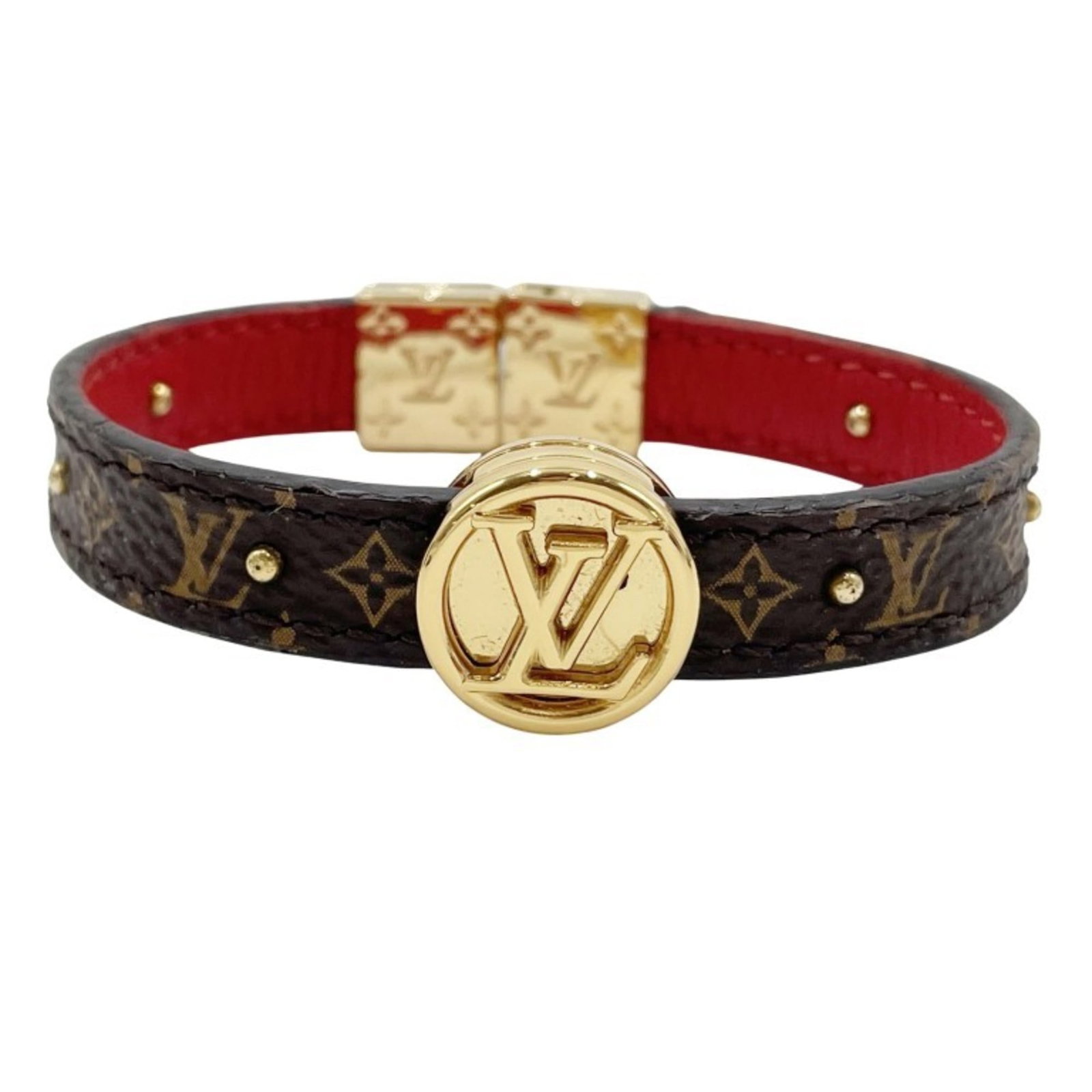 LOUIS VUITTON Charm Bracelet Leather Monogram: LOUIS VUITTON Charm Bracelet Leather Monogram The Louis Vuitton Charm Bracelet Leather Monogram is a stylish accessory featuring the iconic monogram pattern in rich brown and rouge hues. Made from hig