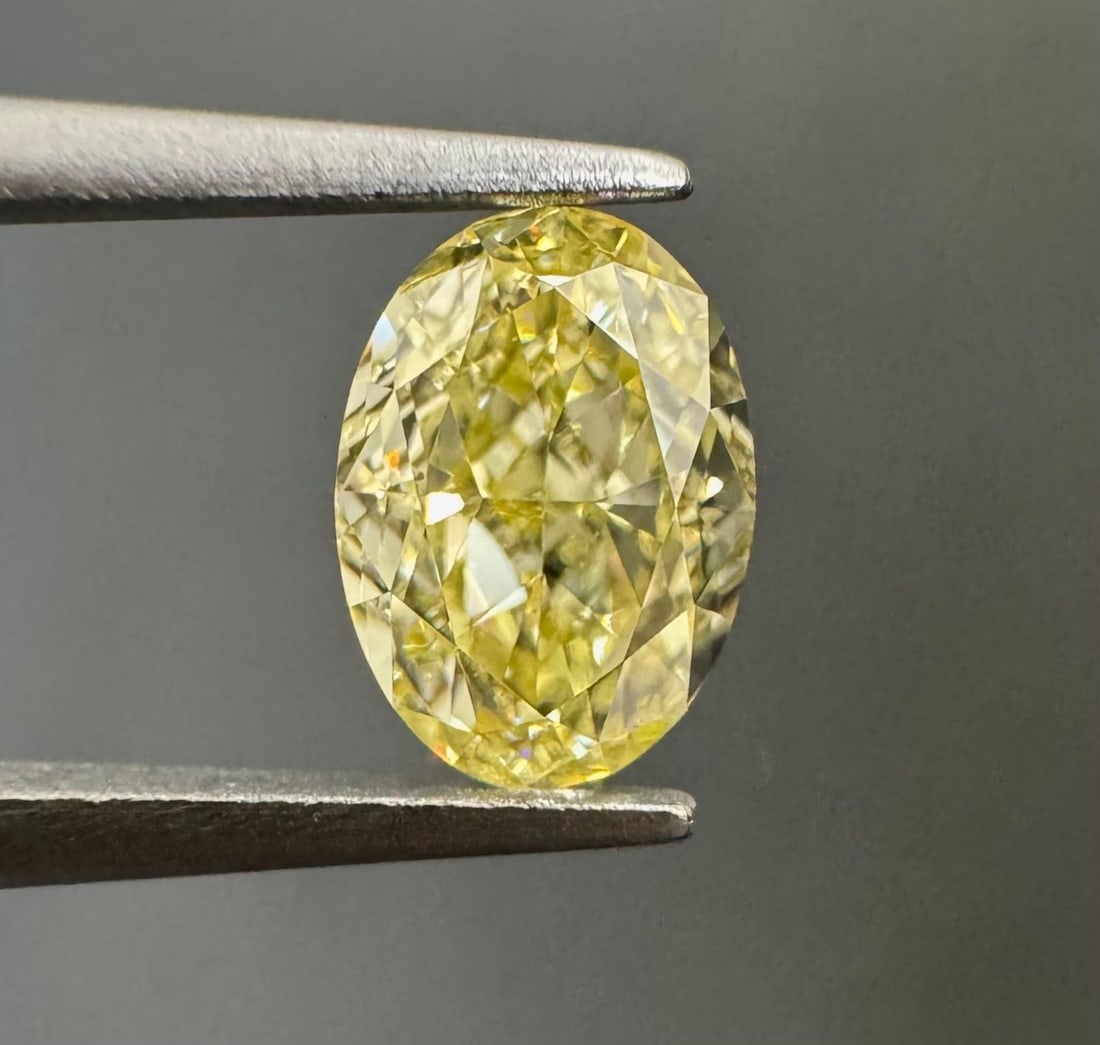 GIA Oval 0.57ct Fancy Light Yellow VVS2 - Loose Natural Diamond: GIA Oval 0.57ct Fancy Light Yellow VVS2 - Loose Natural Diamond GIA Oval 0.57ct Fancy Light Yellow VVS2 - Loose Natural Diamond. This stunning 0.57ct Fancy Light Yellow VVS2 diamond boasts